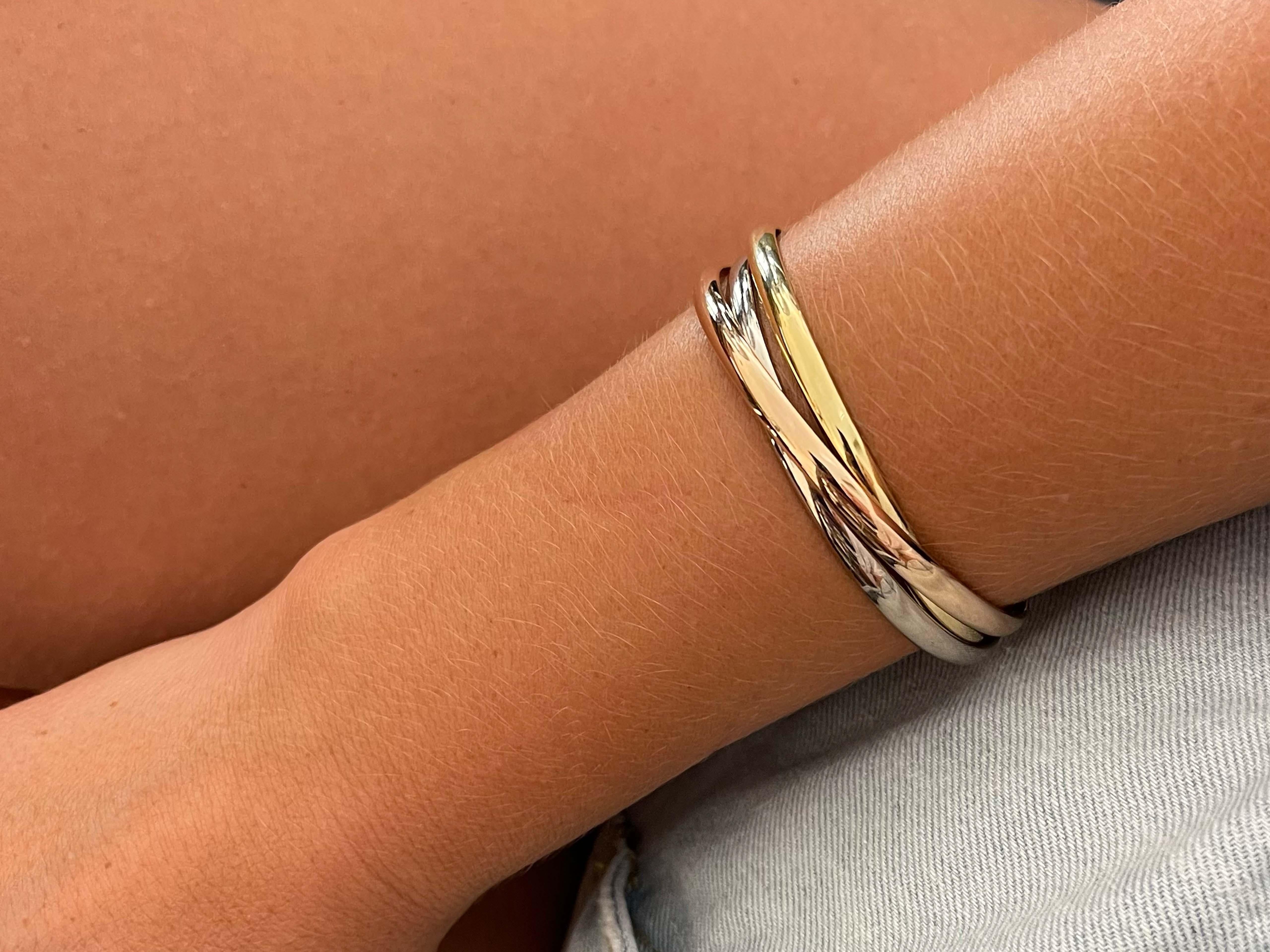 Item Specifications:

Brand: Cartier

Style: Cartier Trinity Bracelet

Metal: 18K White Yellow and Rose Gold

​Inside Diameter: 2.5