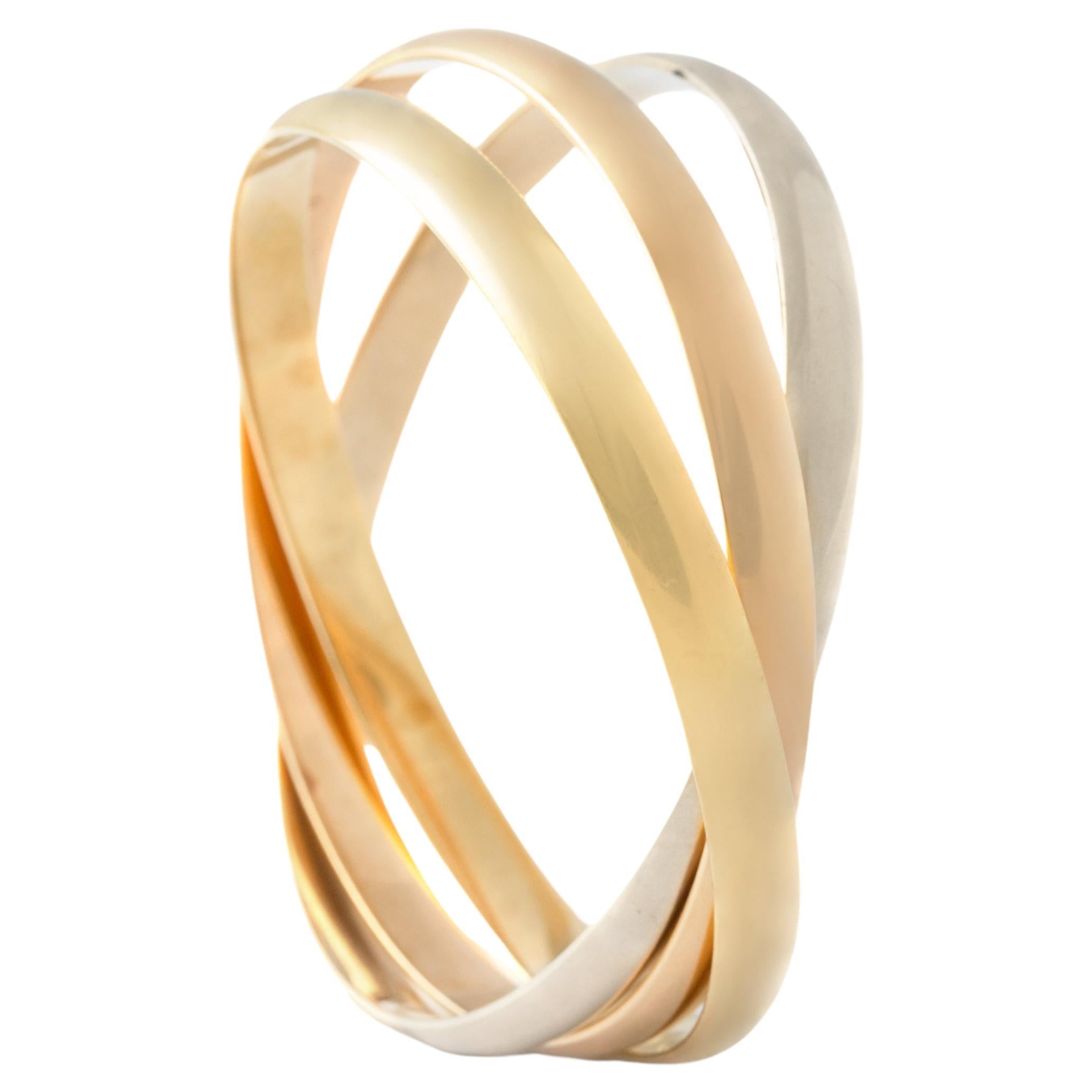 Cartier Trinity Bracelet tri-color Gold 18K.
Signed Cartier, numbered and marked.
Total weight: 81.36 grams.