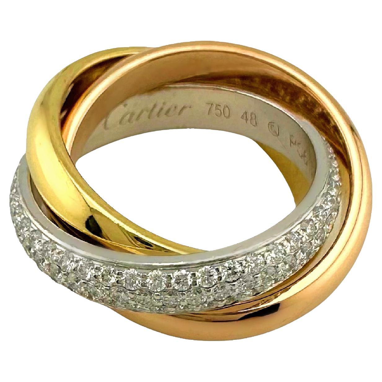 Cartier Trinity Diamond Classic Model Half-Paved Ring
Style:  Ring Medium Model
Ref. number:  B4038948
Metal:  18k White Rose Yellow Gold
Size / Measurements:  48- 4.5 US
Width:  3.9 mm
Main Diamond:  144 Round Brilliant Diamonds 0.99 tcw
Color &