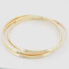 Cartier Trinity Constellation Armreif Armband aus Gelbgold mit 1 Karat Diamanten