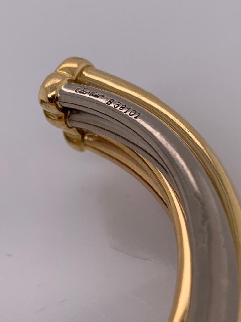 18K white, yellow and rose gold; inner circum. measures 6-1/4 inches, width 1/2 inch; weight 35.90 g.

Signed: Cartier, CARTIER 1992; Numbered: B38101 Stamped: 750

SKU#B-01972