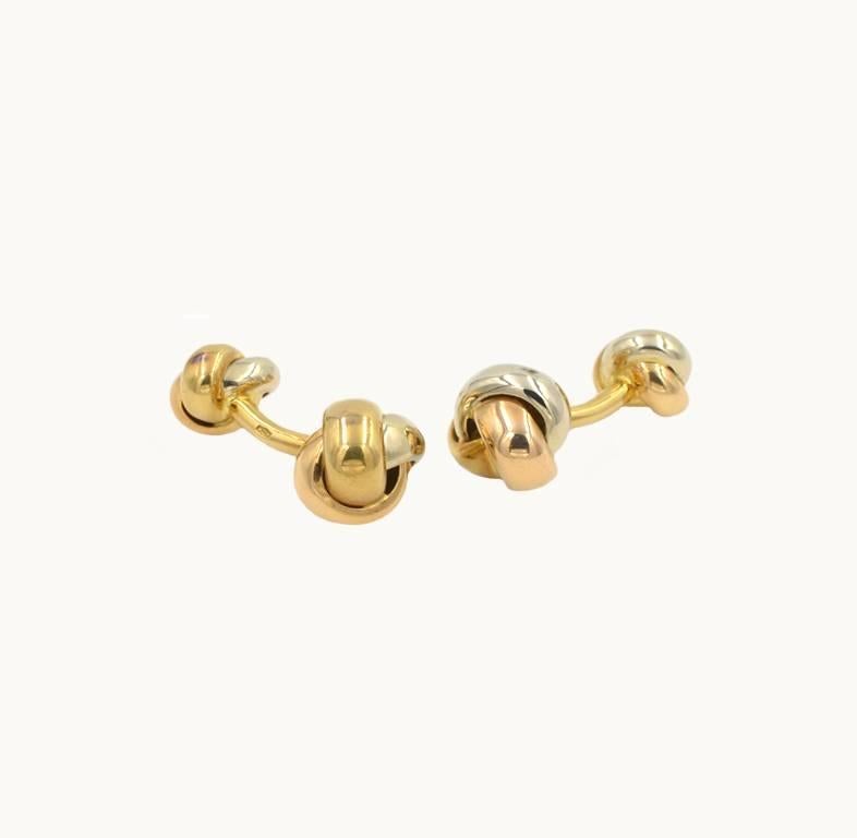 Cartier Trinity cufflinks in 18 karat yellow, white and pink gold.  Classic and timeless design! Cartier signed and numbered.

These cufflinks measure approximately 1.06 inches in length and 0.55 inches in width.