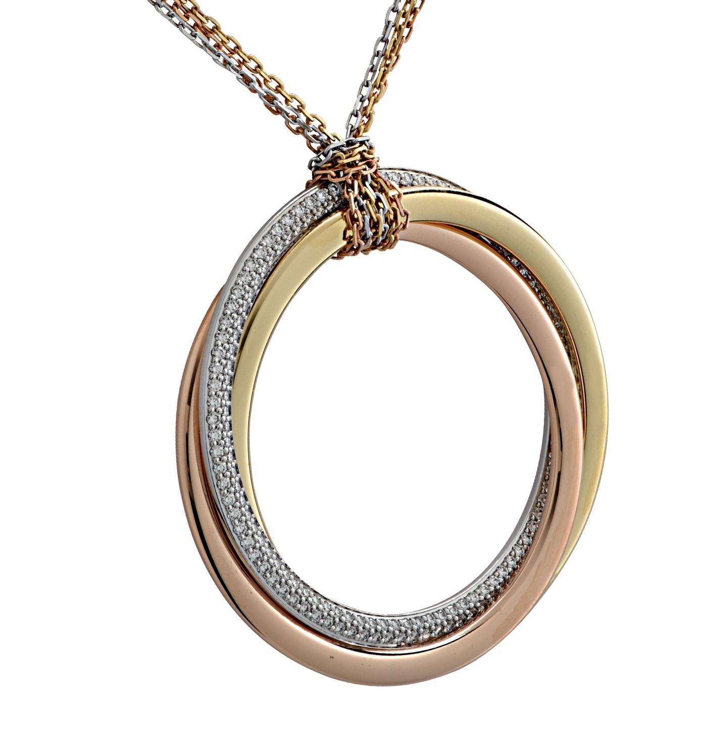 From the iconic house of Cartier, this spectacular Trinity de Cartier diamond necklace is expertly crafted in 18 karat yellow gold, white gold and rose gold. Three interlinked tri-color rings, one of which is diamond encrusted, are suspended from an