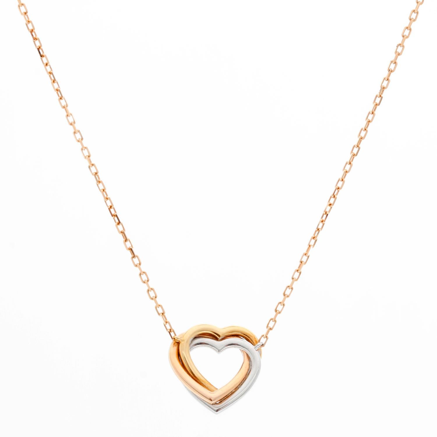 Cartier Trinity de Cartier Heart Diamond Necklace  - This Trinity de Cartier necklace is a true symbol of the spirit of Cartier. It has a pendant crafted with 18k pink, yellow and white gold, decorated with 33 diamonds totaling 0.08 ct. on each