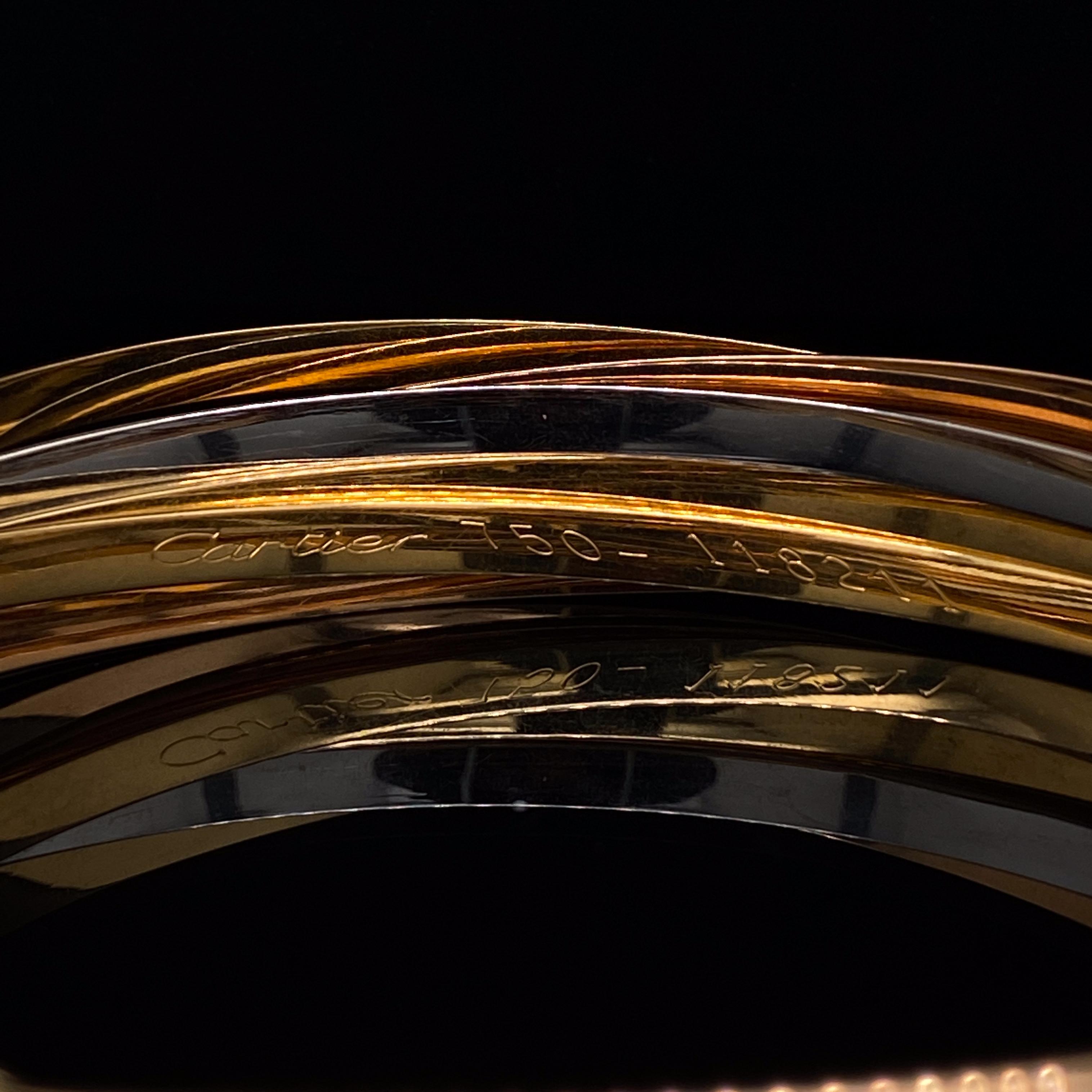 Cartier ‘Trinity de Cartier’ Seven Bangle Bracelet

This classic, vintage piece is composed of seven interlocking bangles, three in yellow gold and two pairs in white and rose gold. 
Louis Cartier created the trinity ring in 1924 and each colour is