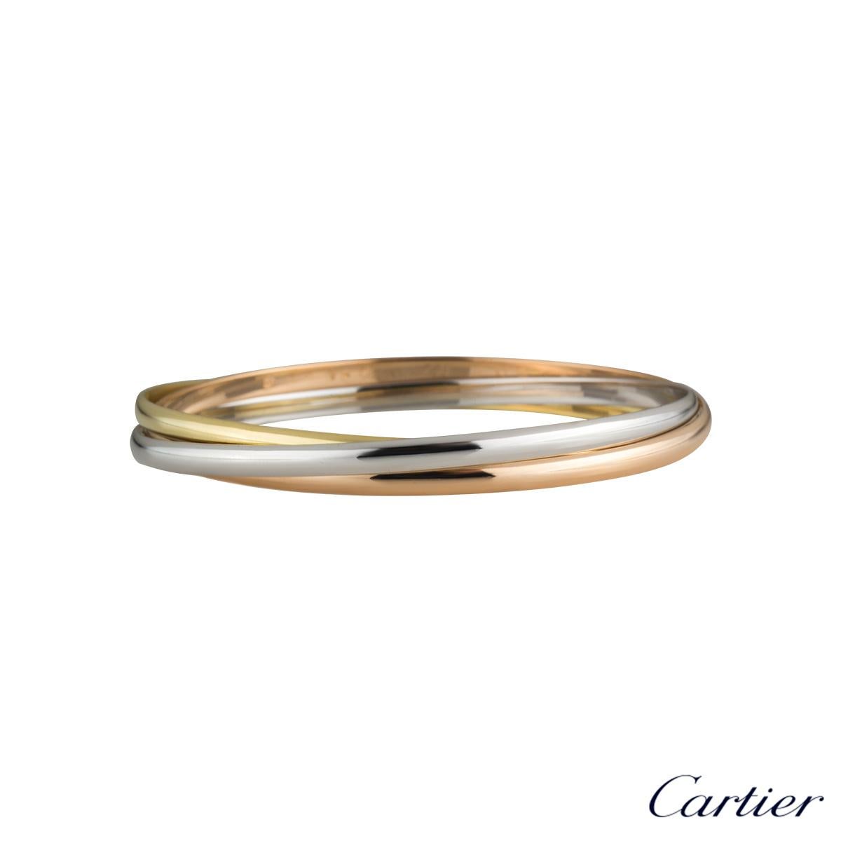 An iconic 18k tri-colour gold Cartier bracelet from the Trinity de Cartier collection. The bracelet is made up of three intertwined 18k rose, white and yellow gold 3.2mm bands. The bracelet fits a wrist size of up to 20cm and has a gross weight of