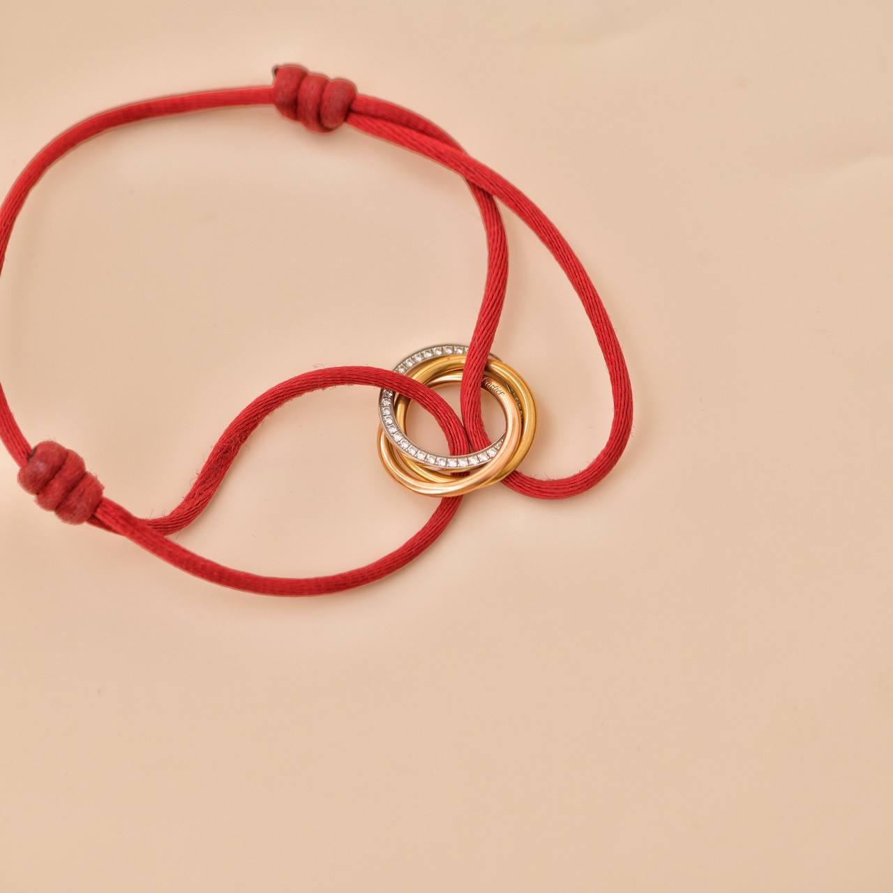 Cartier Trinity Diamond 18K Yellow Rose and White Gold Red Cord Bracelet In Excellent Condition In Banbury, GB