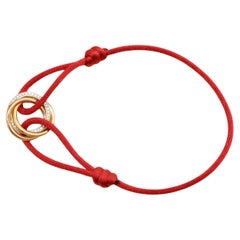 Cartier Trinity Diamond 18K Yellow Rose and White Gold Red Cord Bracelet