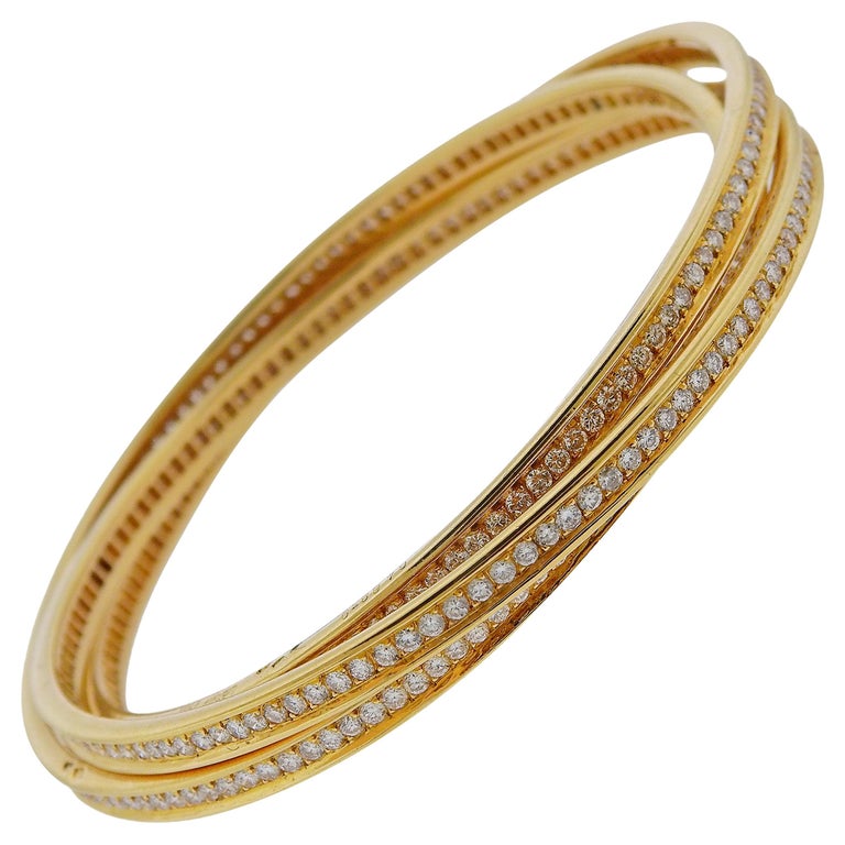 Bracciale Rolling Bangle in oro con diamanti Trinity di Cartier in