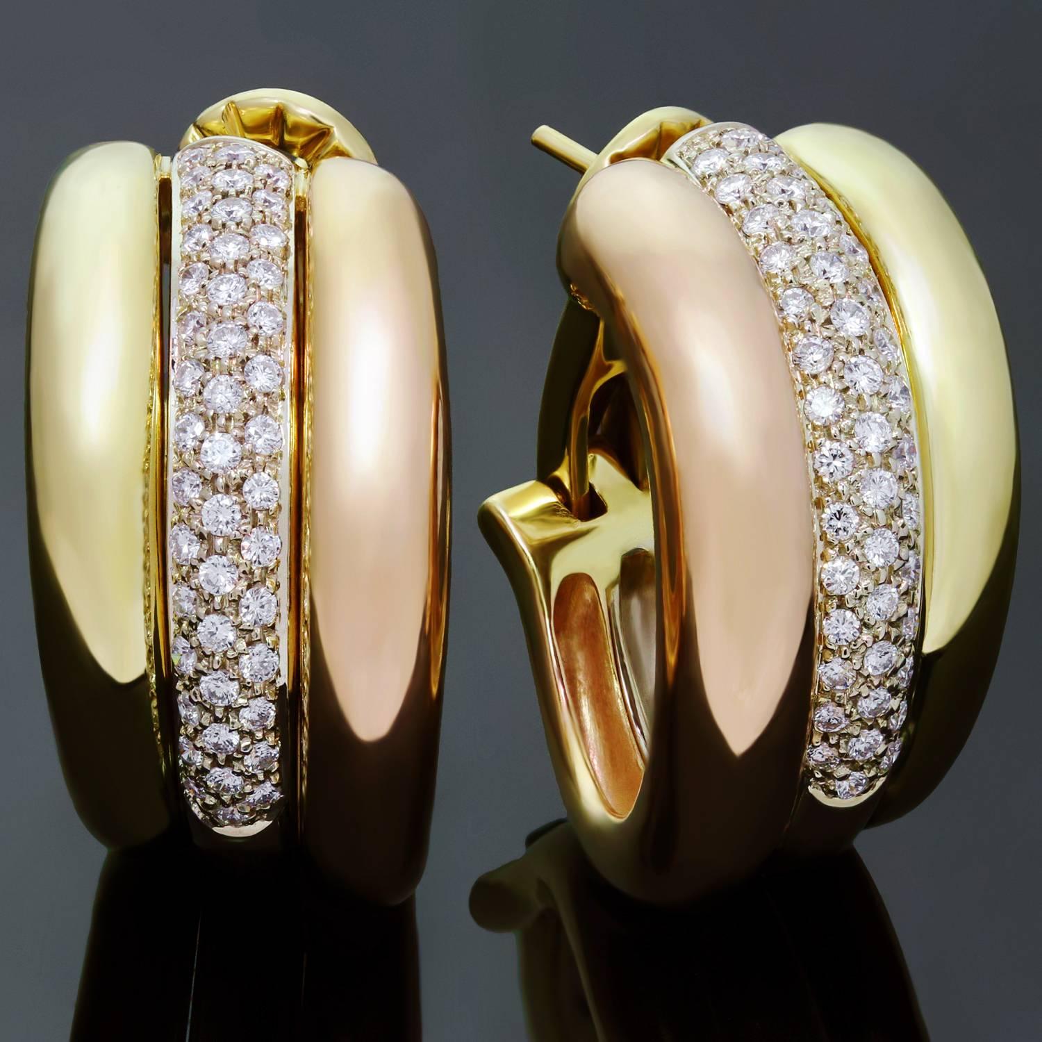 These gorgeous oval wrap earrings from Cartier's Trinity collection are crafted in 18k yellow, white and rose gold and pave-set with brilliant-cut round diamonds of an estimated 1.35 carats in white gold. An iconic design for everyday elegance. Made