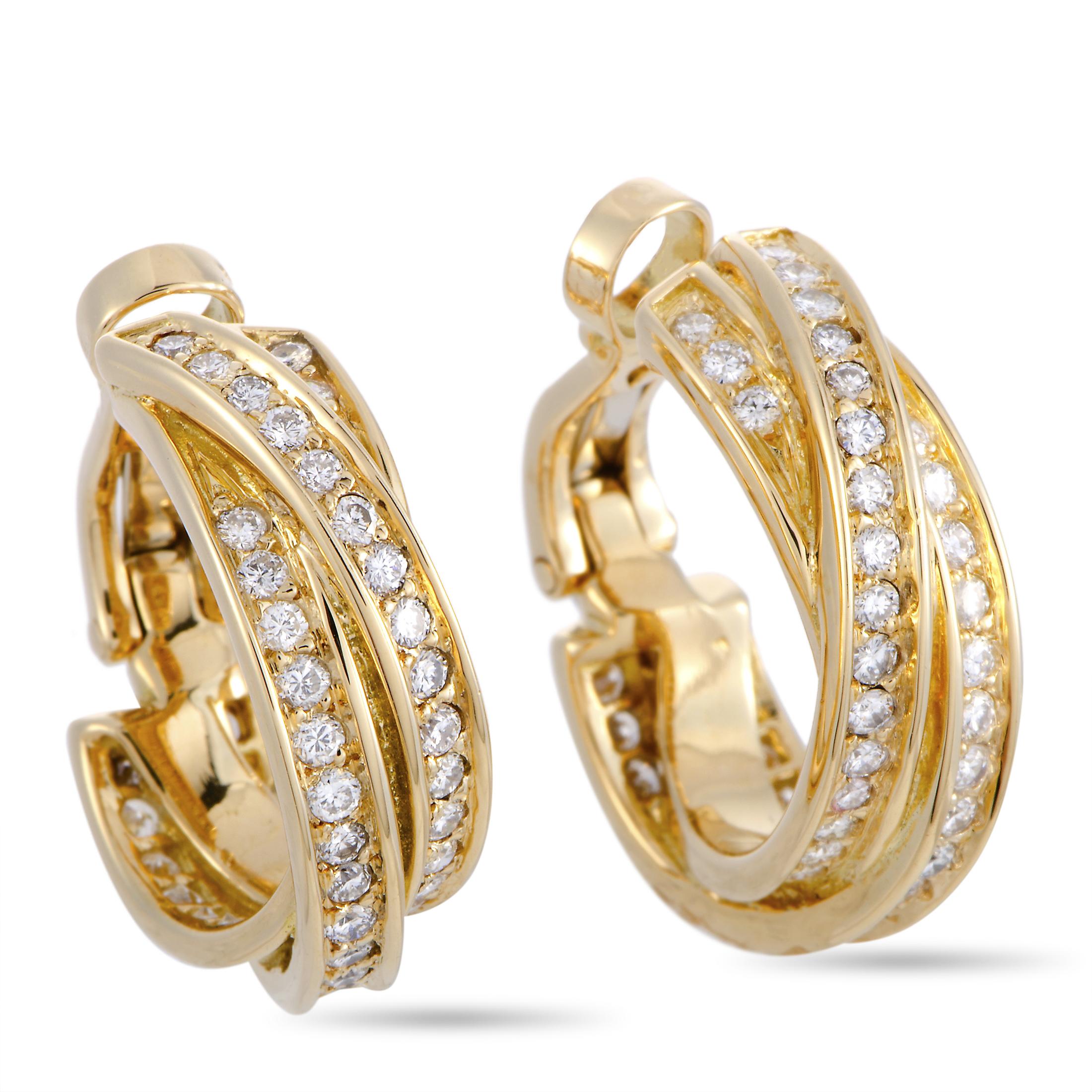 The Cartier “Trinity” earrings are made out of 18K yellow gold and diamonds and each of the two earrings weighs 7.35 grams, measuring 0.81” in length and 0.25” in width.

This pair of earrings is offered in estate condition and includes a gift box.