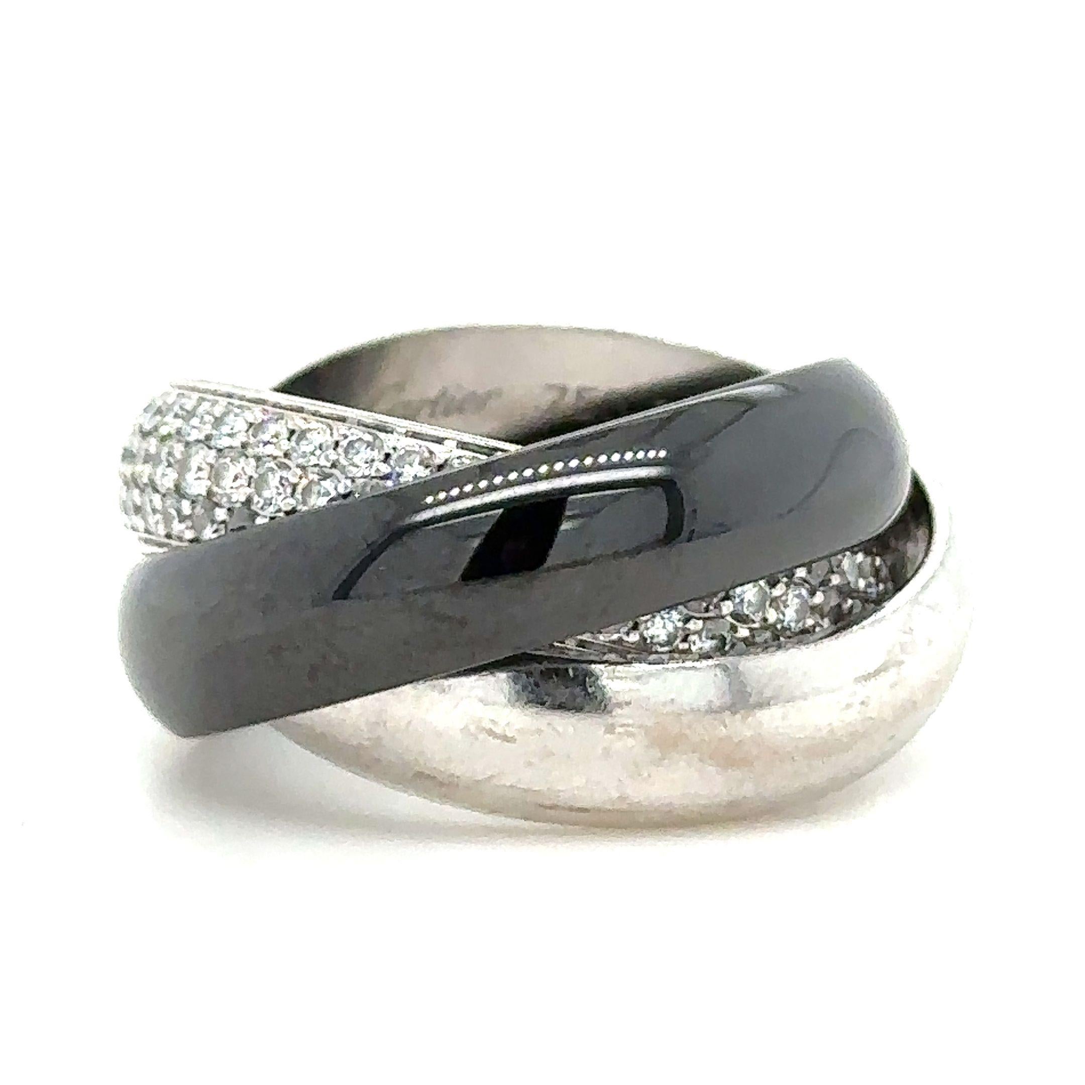 A Cartier Trinity Diamond Ring.

One hundred and twenty five 1.3mm round brilliant cuts, D/E colour, VS clarity, 1.54 carat estimated total weight. Ref CARTIER N5353753

The three band set of rings comprise of one totally pavé set 5.4mm wide domed