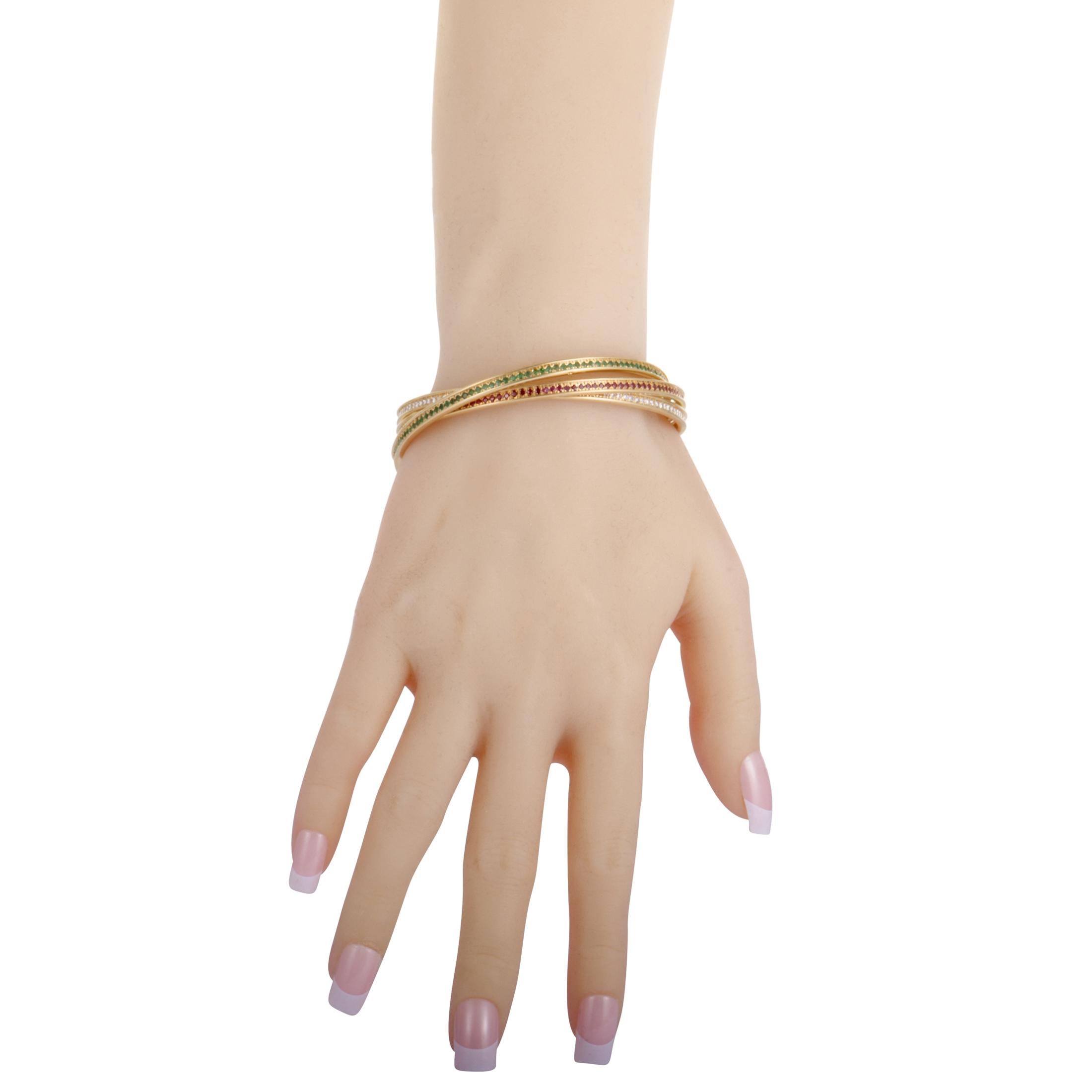An exemplary representative of the iconic “Trinity” collection by Cartier, this splendid bracelet will elevate your style in a compellingly luxurious manner. The bracelet is beautifully crafted from 18K yellow gold and expertly set with a plethora