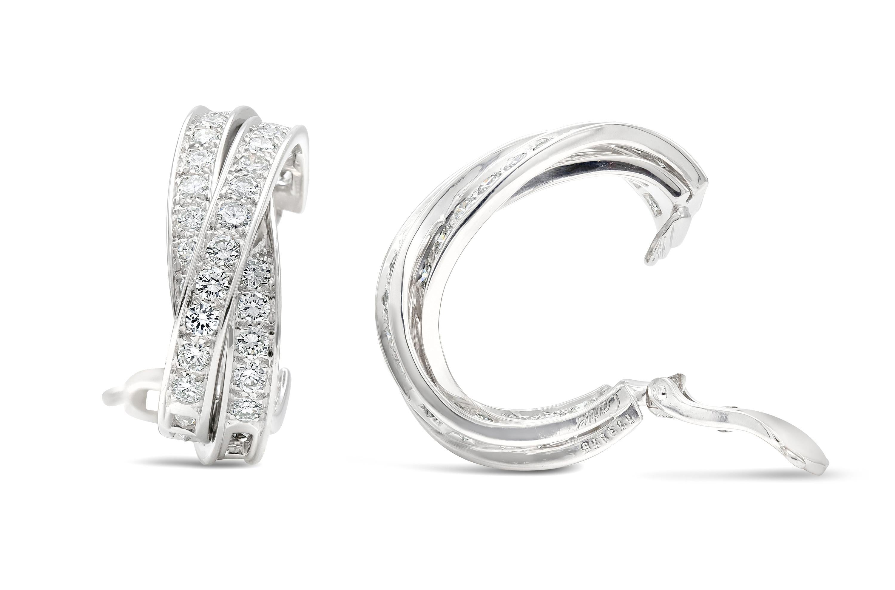Finely crafted in 18k white gold with round brilliant cut diamonds weighing approximately a total of 6.00 carats.
Signed by Cartier, from their Trinity collection.