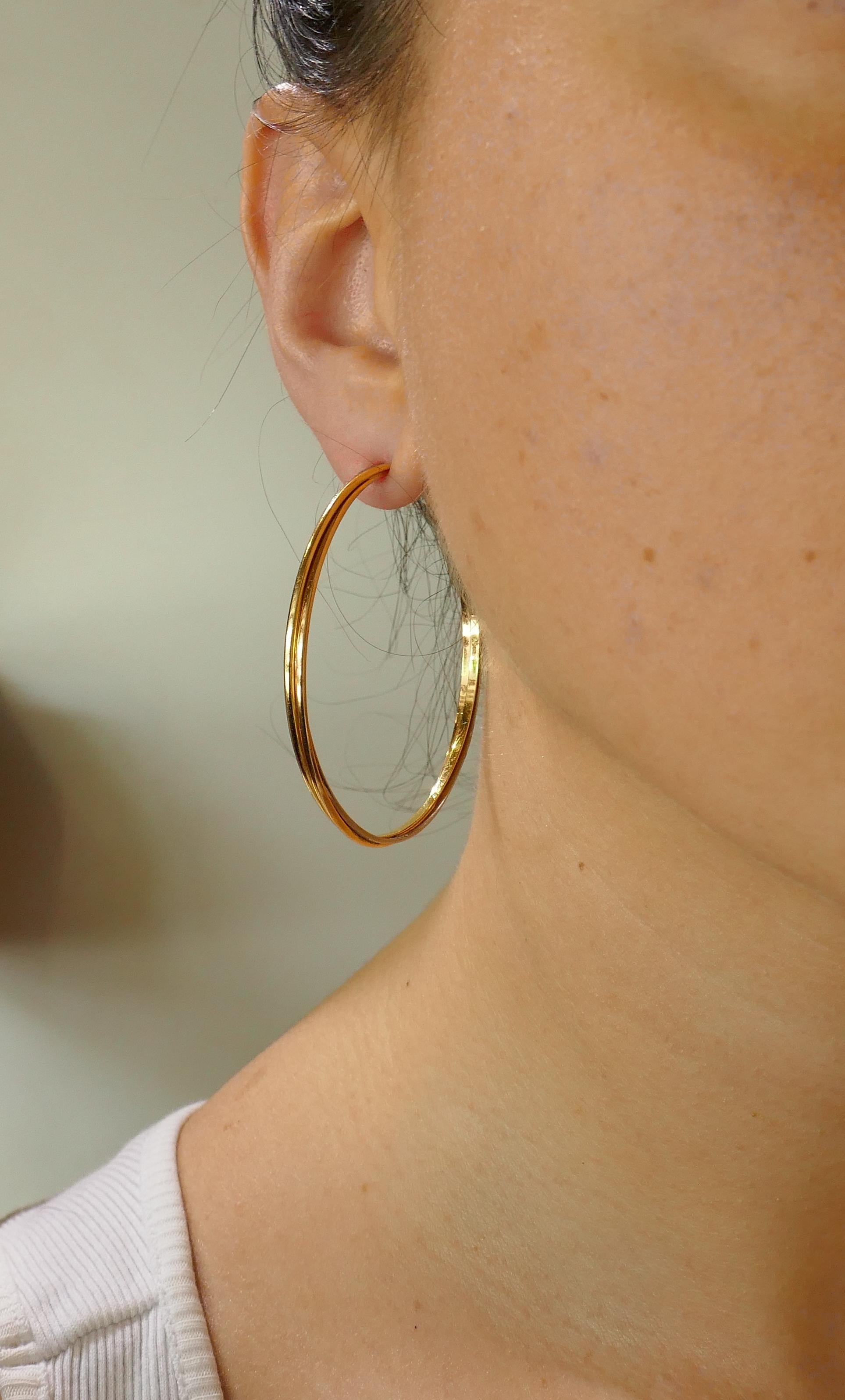 Chic and wearable Trinity hoop earrings that are a 