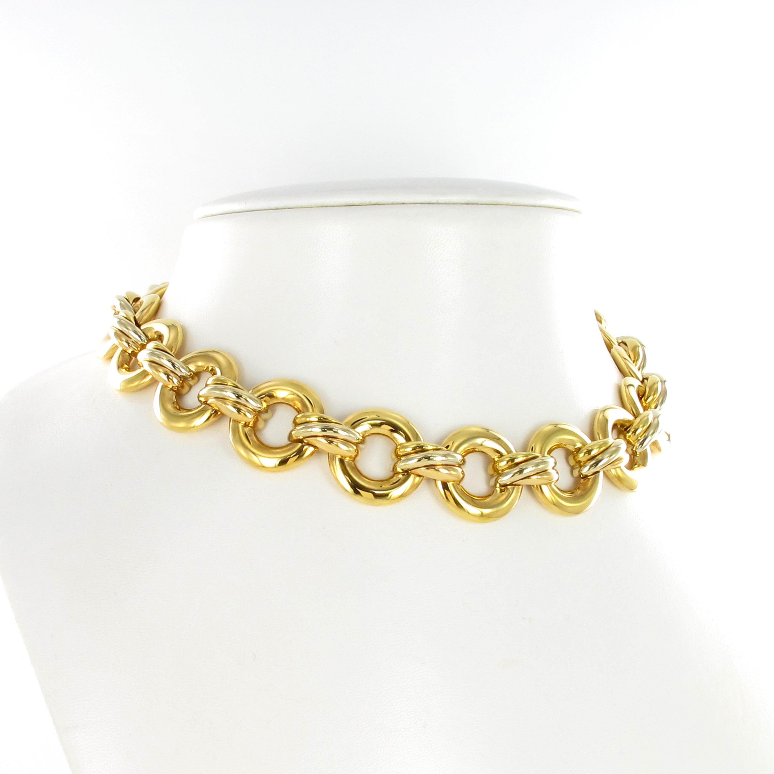 18 round links in yellow gold conected together by iconic Cartier Trinity elements in 18K yellow, rose and white gold.
This Retro looking necklace is comming with original box.   

inner circumference measures approximately 14 inches, 13/16 at