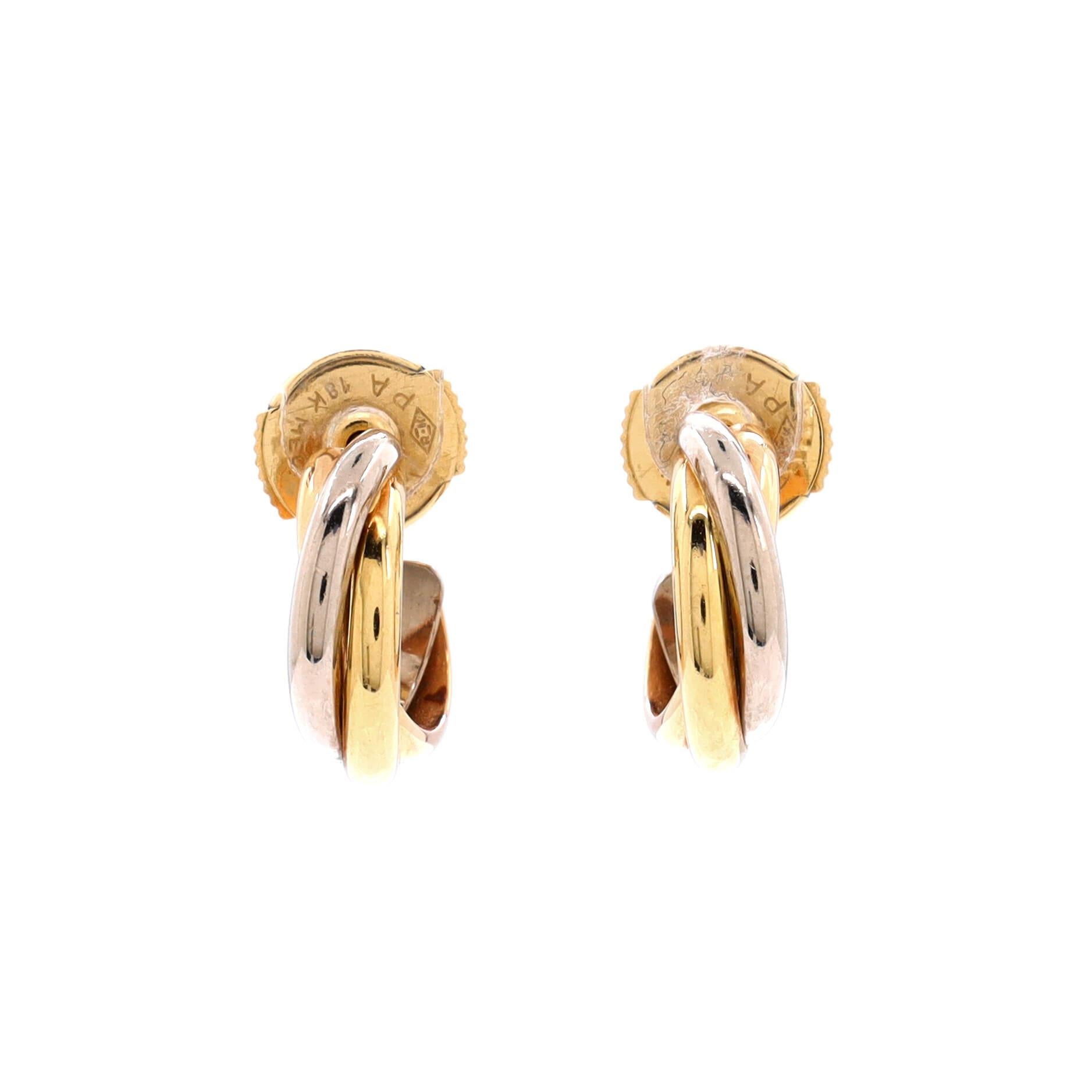 Condition: Very good. Moderate wear throughout.
Accessories: No Accessories
Measurements: Height/Length: 12.85 mm, Width: 3.85 mm
Designer: Cartier
Model: Trinity Hoop Earrings 18K Tricolor Gold
Exterior Color: Tricolor Gold
Item Number: 208648/436
