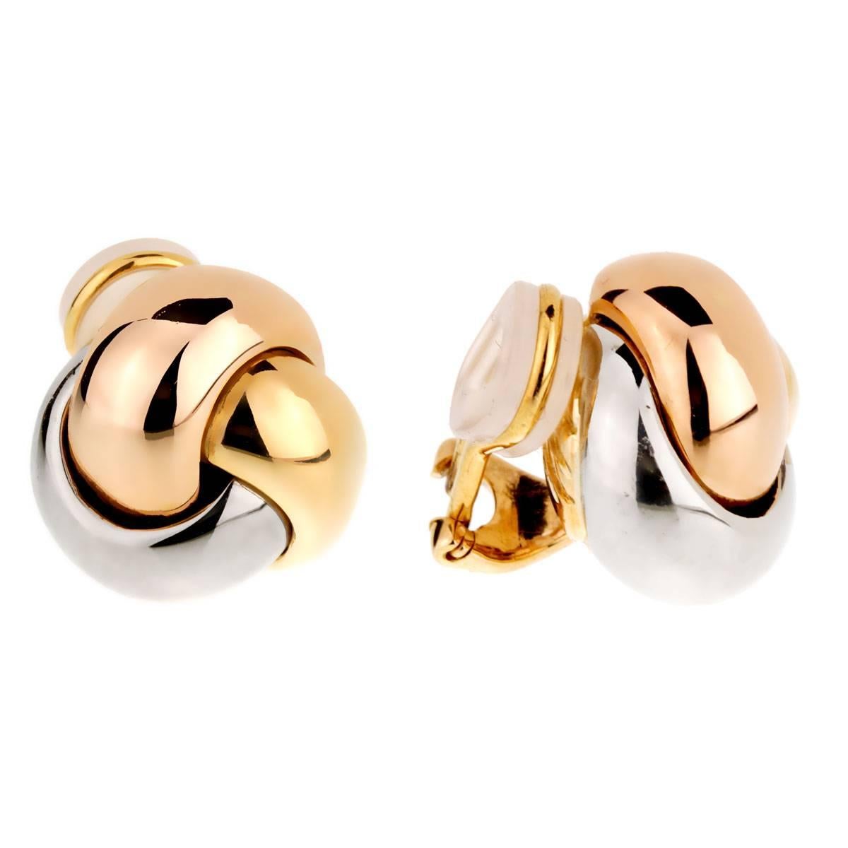 A timeless pair of Cartier Trinity Knot earrings in 18k white, yellow and rose gold.