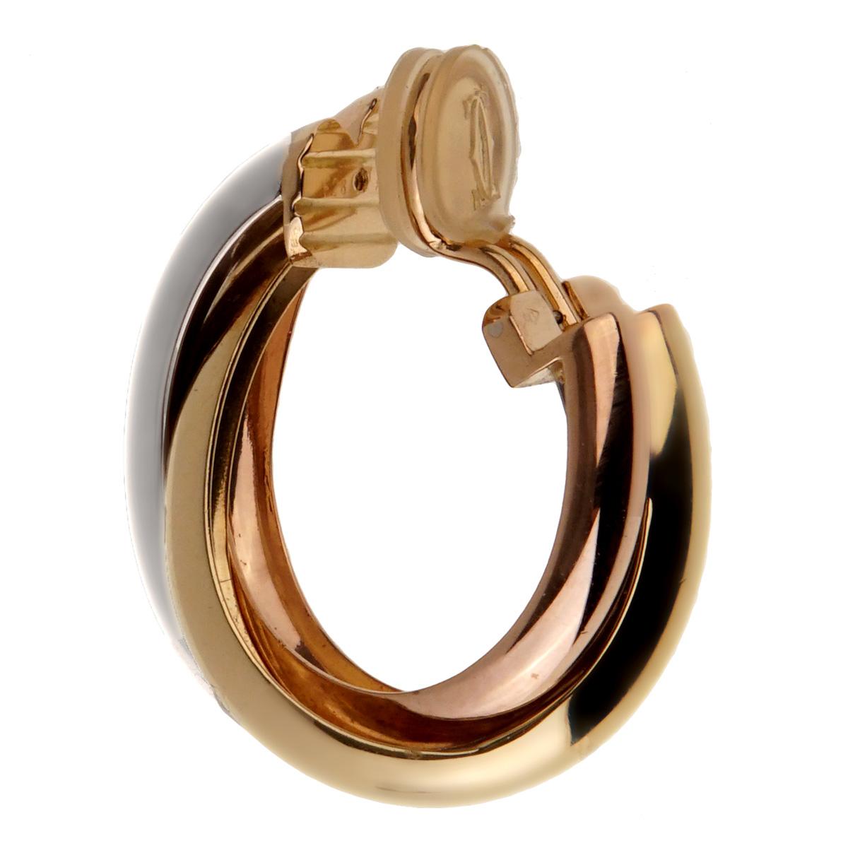 An iconic pair of Cartier Trinity Hoop earrings featuring white yellow and rose gold.