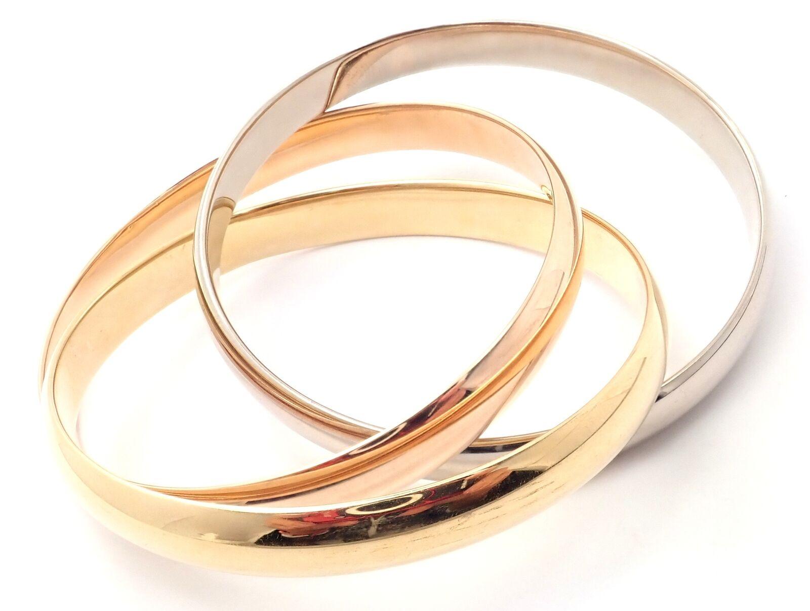 18k Tricolor Gold Large Model Medium Size Trinity Bangle Bracelet by Cartier. 
 Details:
Length: 7