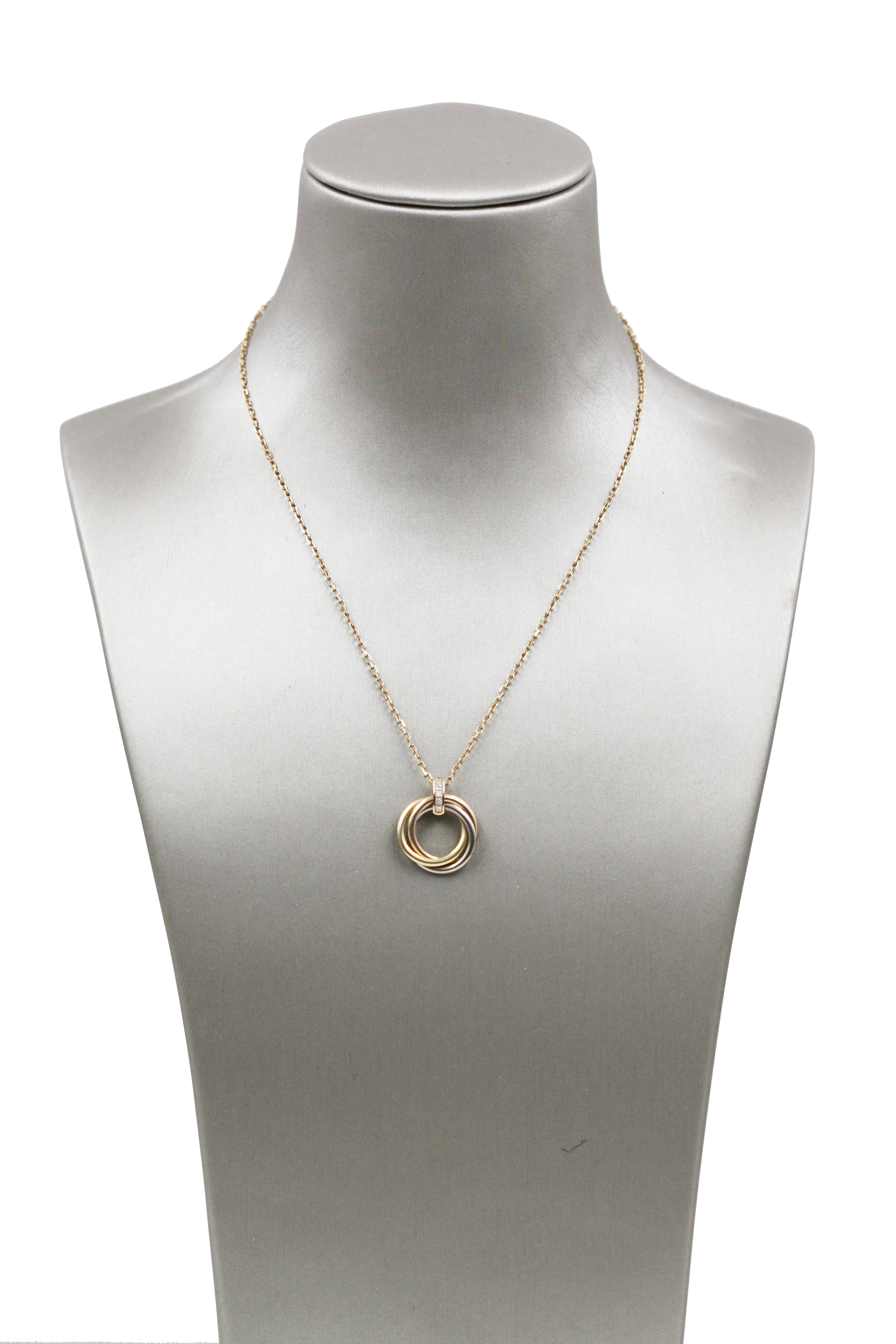 Trinity necklace from Cartier, 18K white gold, 18K pink gold, 18K yellow gold, set with 5 brilliant-cut diamonds totaling 0.06 carat. REF: B7058700

Item come with original box and certificate.
Length: 40 cm (approximately)
Stock#: CTR481