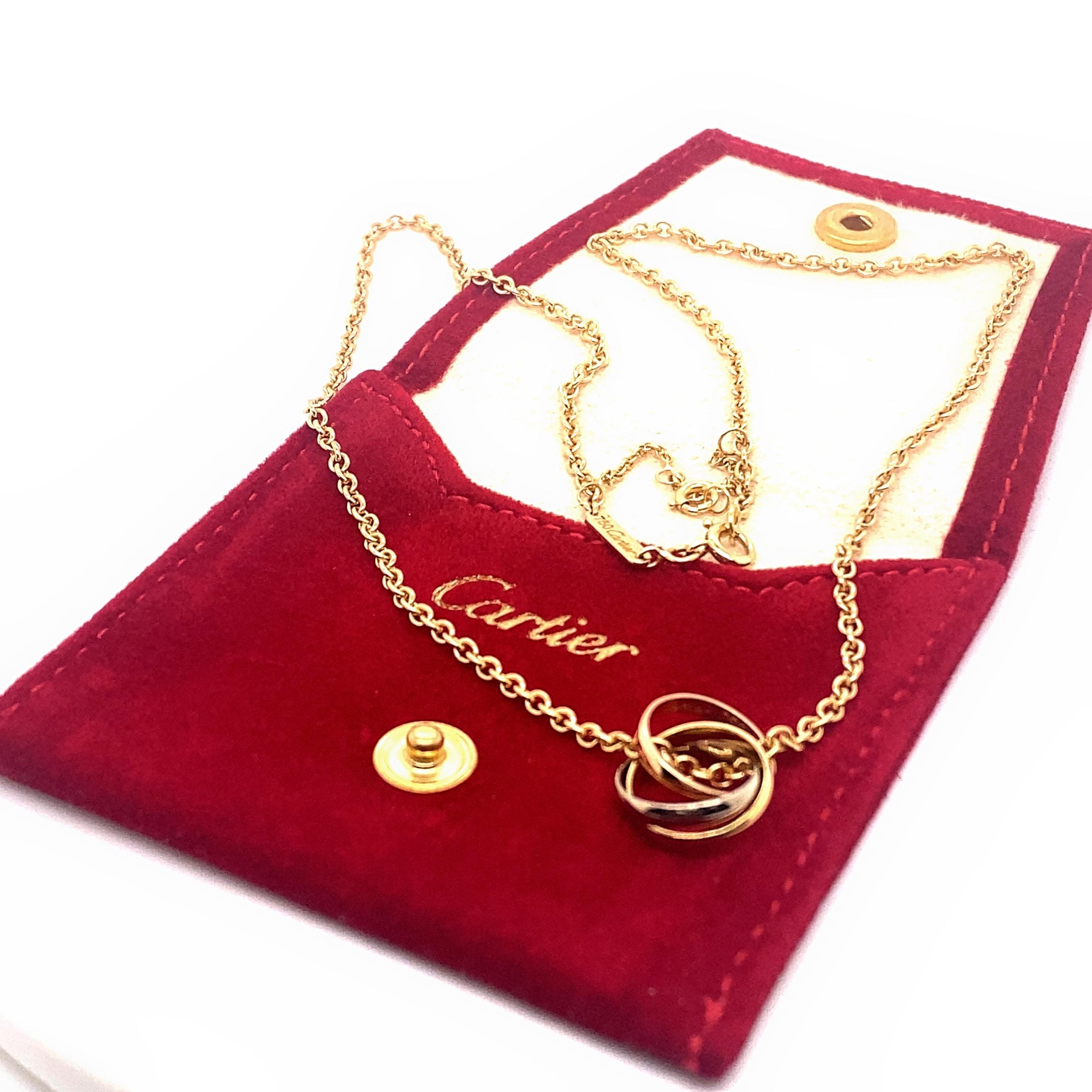 Cartier Trinity Necklace
Style:  Tri-Color Gold Interlocking Rings
Ref. number:  B7224574
Metal:  18kt White Gold Rose Gold
Serial:  GK8***
Size:  16' inches 18kt Rose Gold Chain
Hallmark:  