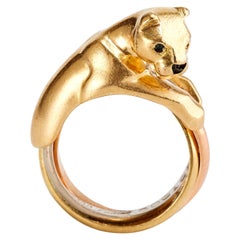 Anello Cartier Trinity Panther in oro giallo con occhi di zaffiro e naso di onice