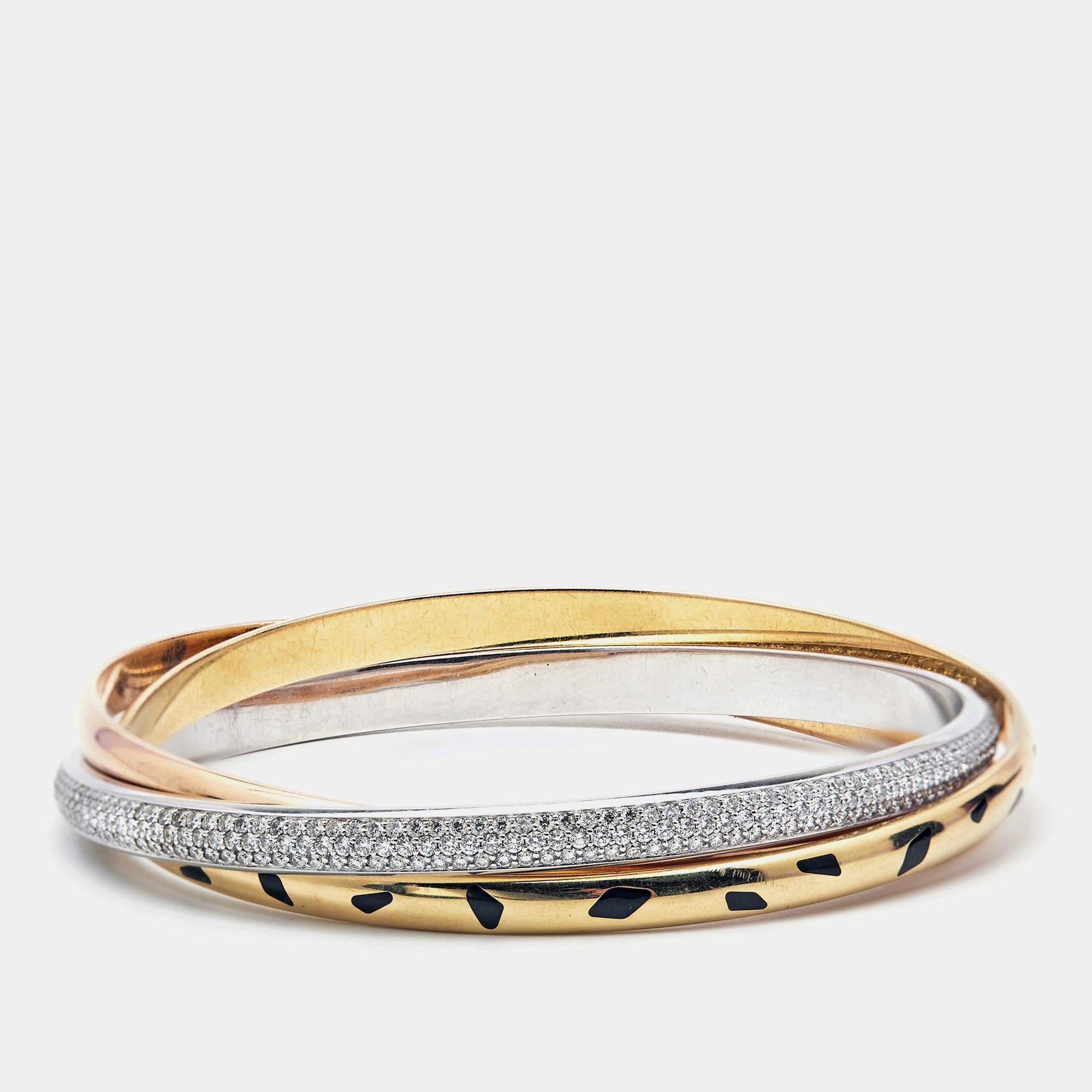 Cartier merged two of its most iconic collections, Trinity and Panthere, and the end result is one you will cherish forever. It is a very rare Cartier bracelet made of 18k rose, white, and yellow gold. The white gold bangle is decked with precious