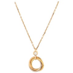 Cartier, collier pendentif Trinity en or tricolore 18 carats avec diamants