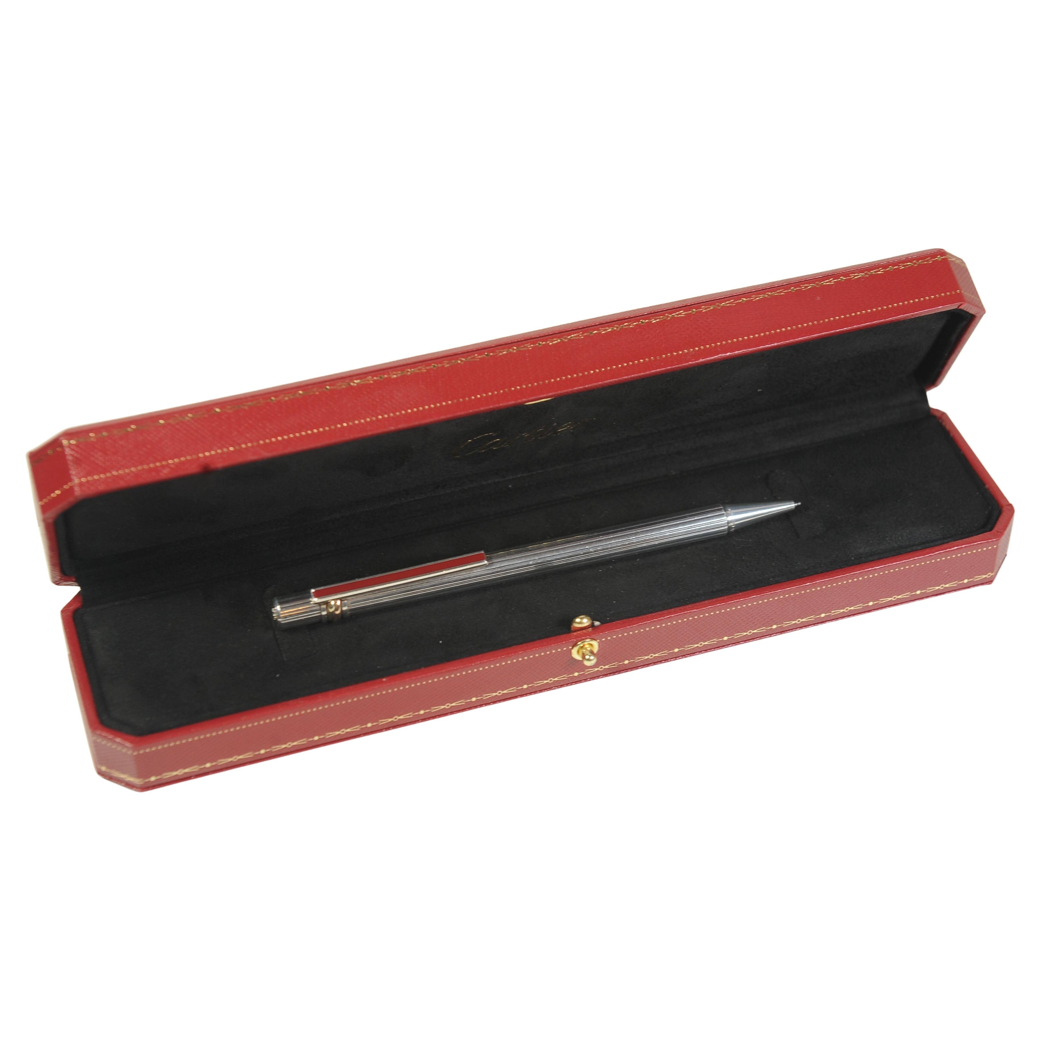 Cartier Trinity Ribbed Silver Plated Ballpoint Pen With Red Cartier Box & Enamel Clip

Stunning Example of a Must De Cartier ballpoint pen, featuring the classic trinity rings and an enamel ident to the clip pen.

Serial ref 145514

Cartier pens are
