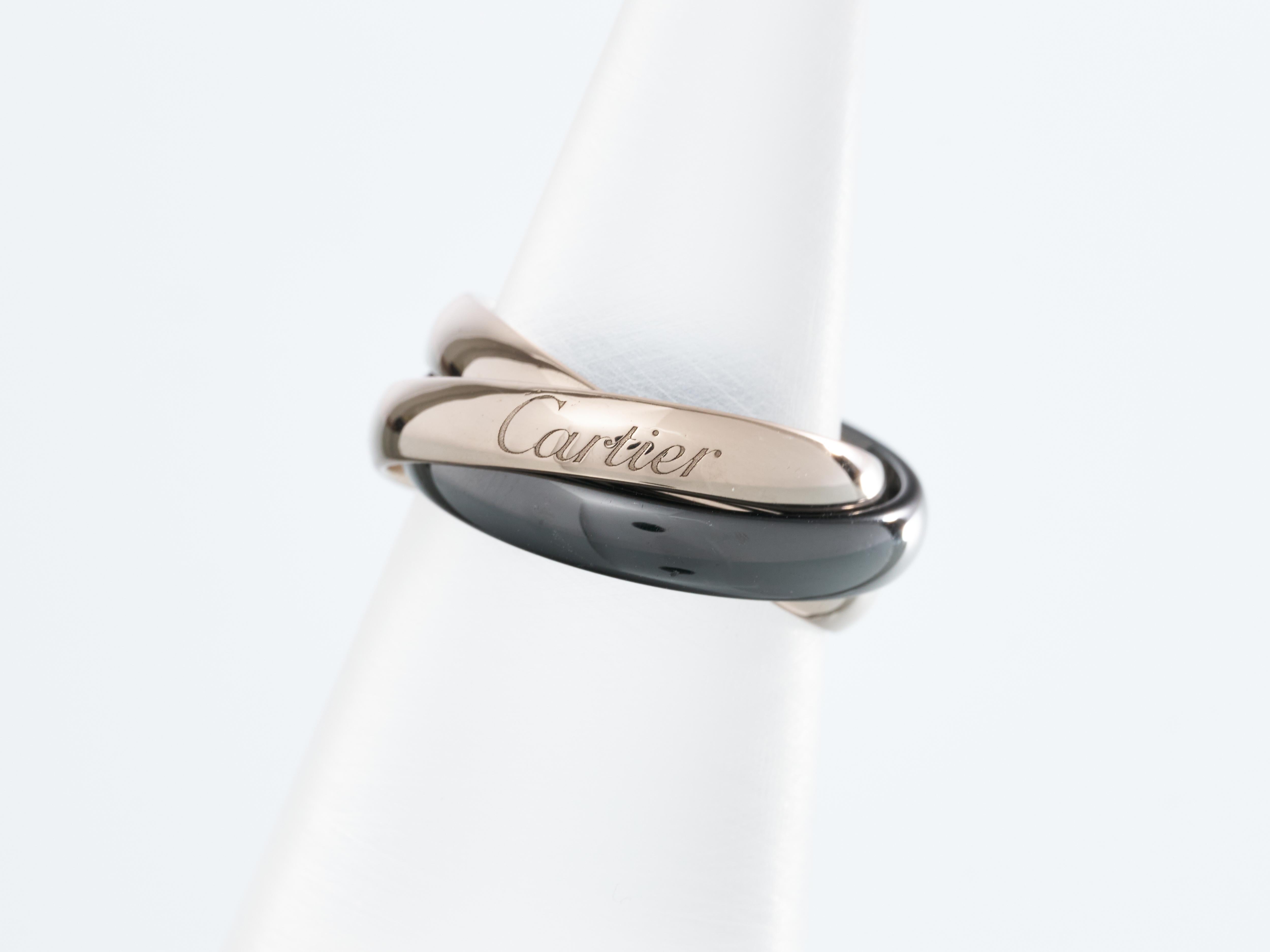 Cartier 
Trinity Ring 
Two 18K White Gold Bands with Black Ceramic band


Size L 
EU 51 
US Size 6
Internal Diameter 16mm

Each band has a width of 3.5mm

Boxed

Immaculate Condition

Total Weight 6.4g

UK Hallmarked

Images show actual item you