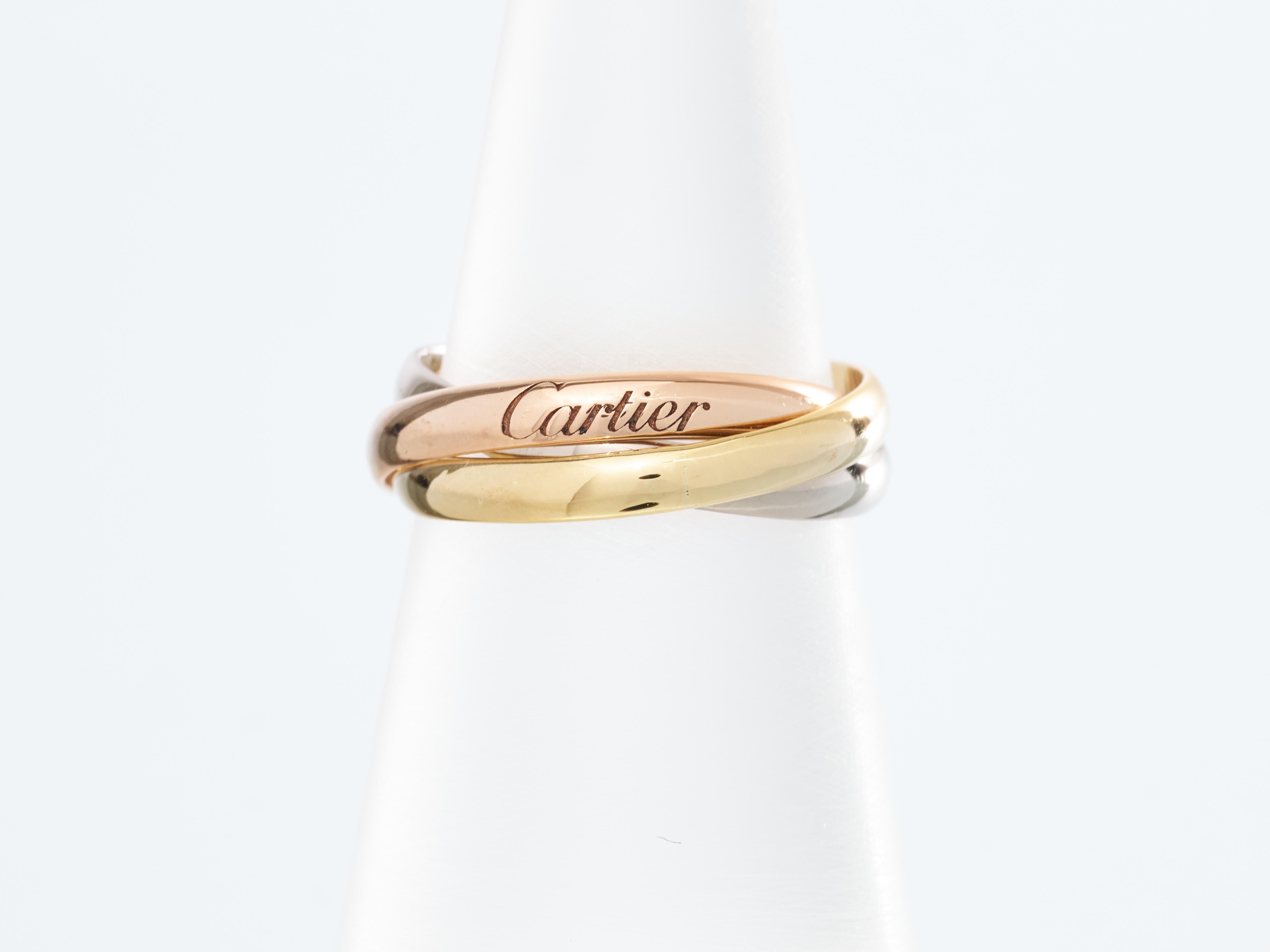 Cartier 
Trinity Ring 



Three ring of 18K Gold : 
White Yellow & Rose 

Was originally Size M EU 53
However it has been reduced to a size K UK  50 EU 
Immaculate Condition

Total Weight 4.1g

UK Hallmarked

Images show actual item you will