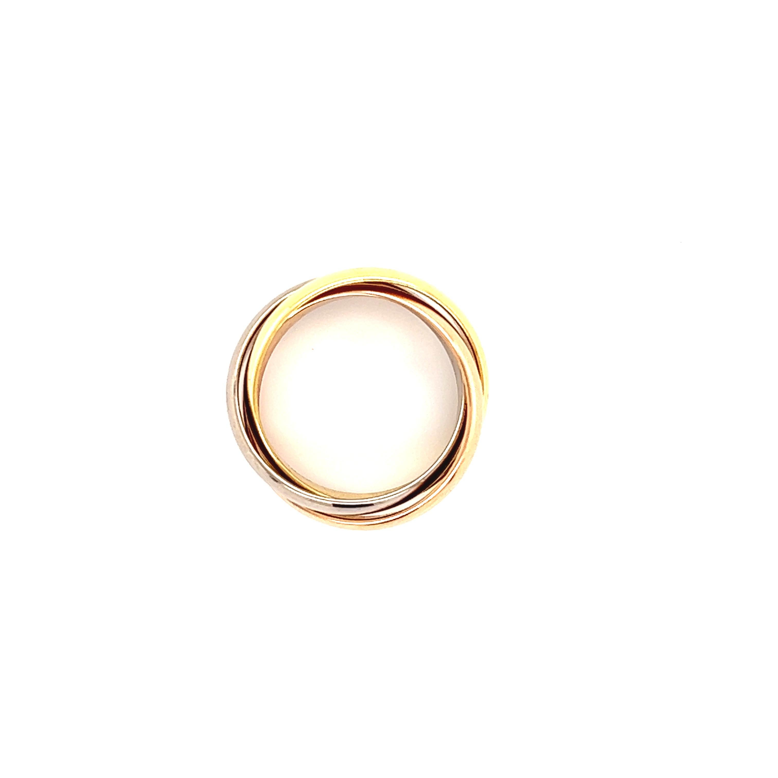 Beautiful ring from famed designer Cartier. The ring is from the Trinity collection and is the classic or medium size.  The ring is a size 51 or US size 5.75. The ring consists of three bands that are connected to  form this beautiful overlapping