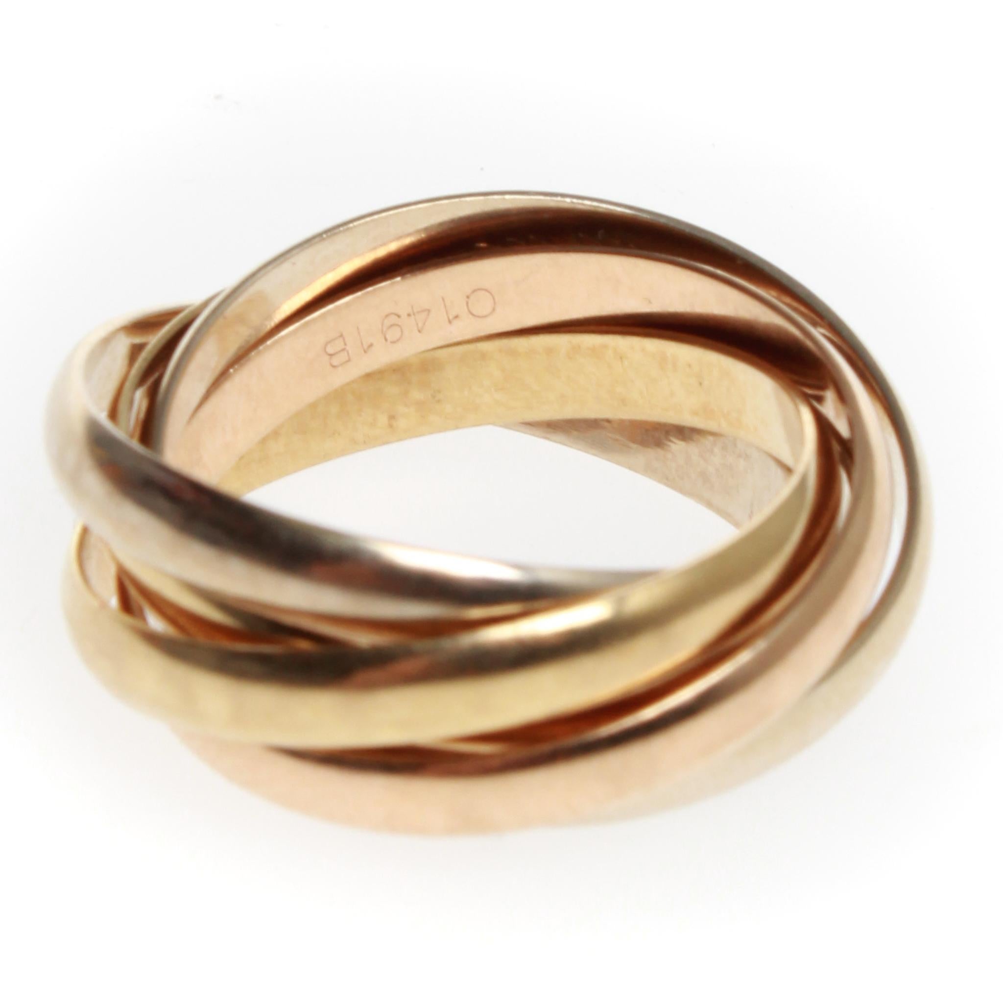 Gorgous 18Kt Gold les must de Cartier 5-Band Trinity Ring. This trinity ring consists of 2 Yellow Bands, 2 White Gold Bands, and 1 Rose Gold Band.
US Size 5.