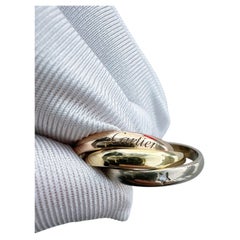 Cartier Trinity Ring in 18k Three-Tone Gold with Star-Set Diamond Accent