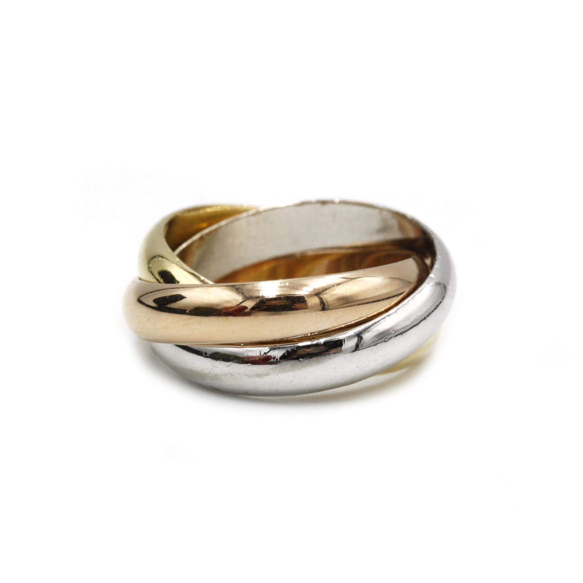 A timeless icon of Cartier’s design legacy, this exquisite “Trinity” ring seamlessly intertwines three polished bands of 18K yellow, white and rose gold. Originally conceived by Louis Cartier in 1924 as a celebration of unity and harmony, the ring’s