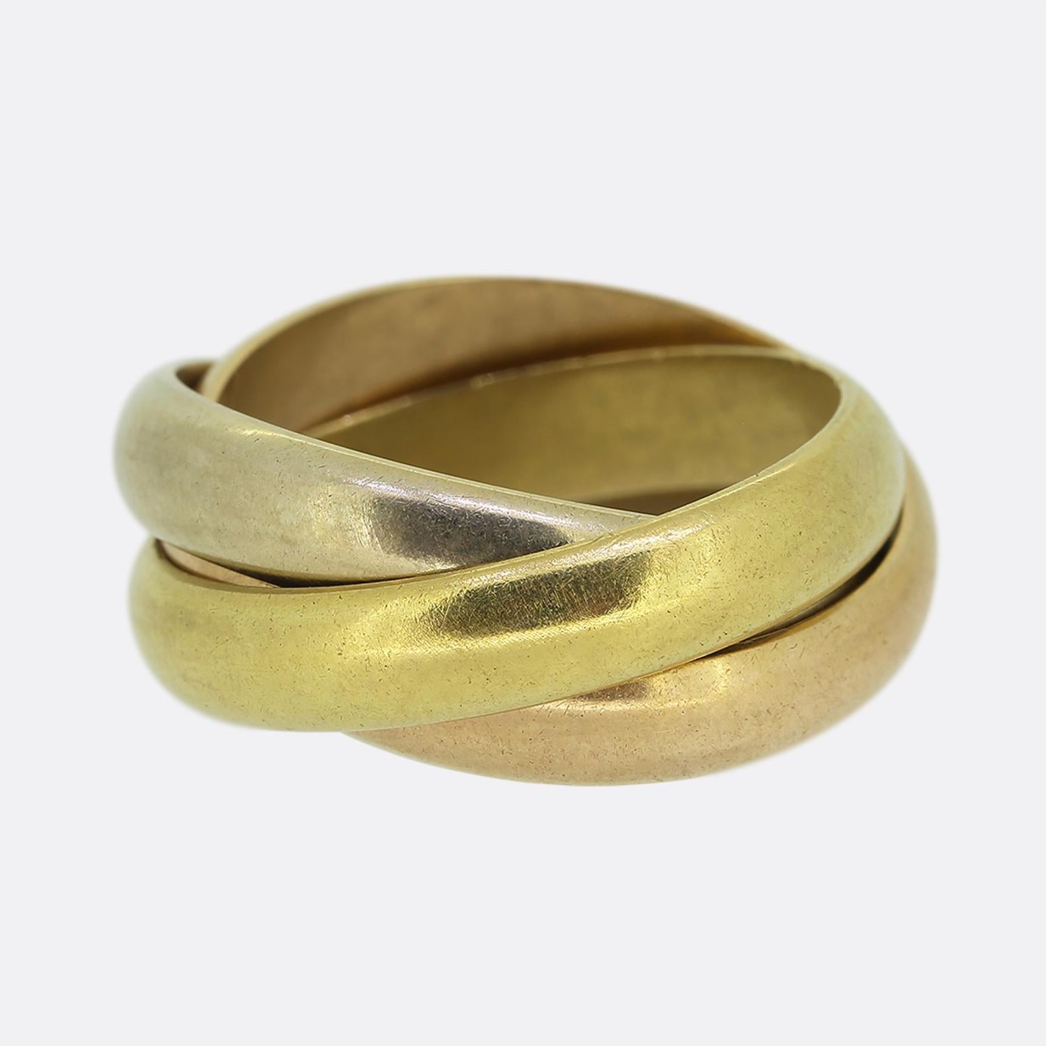Here we have an 18ct gold trinity ring from the luxury jewellery designer Cartier. The ring features three interwinding gold bands including yellow, white and rose. 

Please note the Cartier marks on the ring have faded over time and are now barely