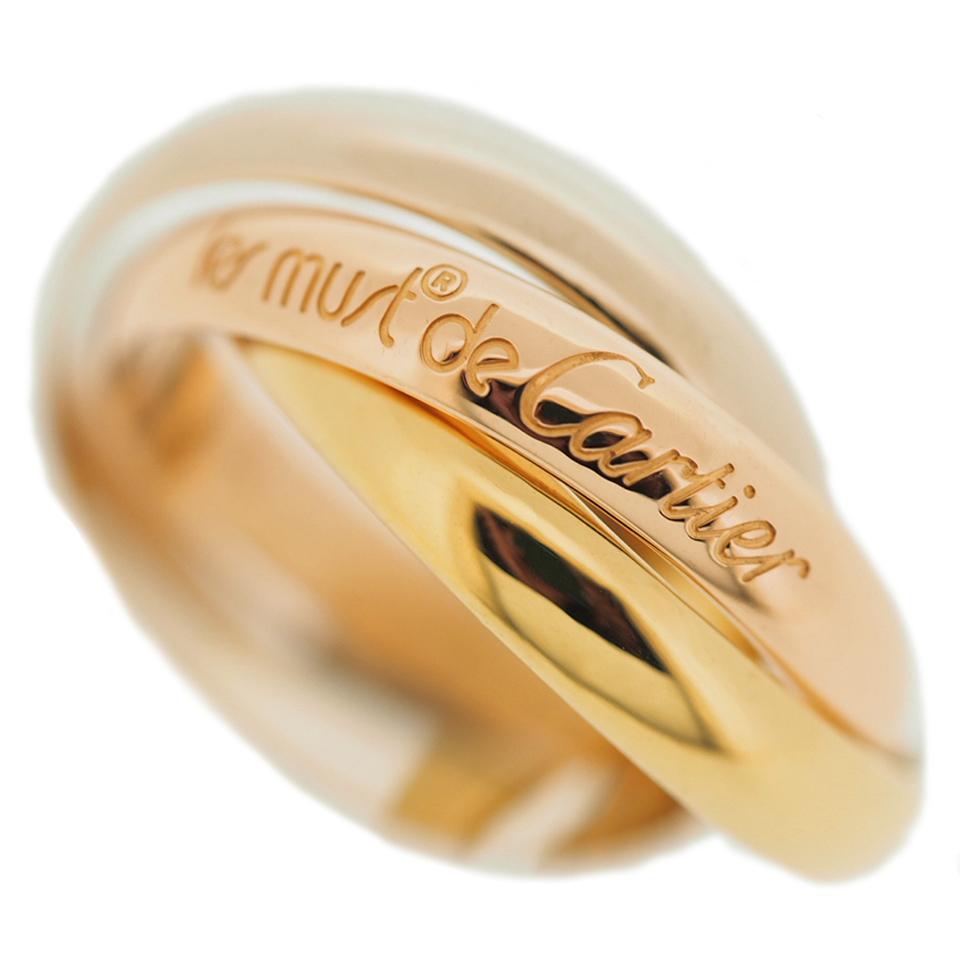 Item: Cartier Trinity Ring (previous model)
Stones: ---
Metal: 18K Yellow / Rose / White Gold
Ring Size: 51 US SIZE 5.5 UK SIZE K 1/4
Internal Diameter: 16.15 mm
Measurement: 3.4 mm
Weight: 7.4 Grams
Condition: Used (repolished)
Retail Price: