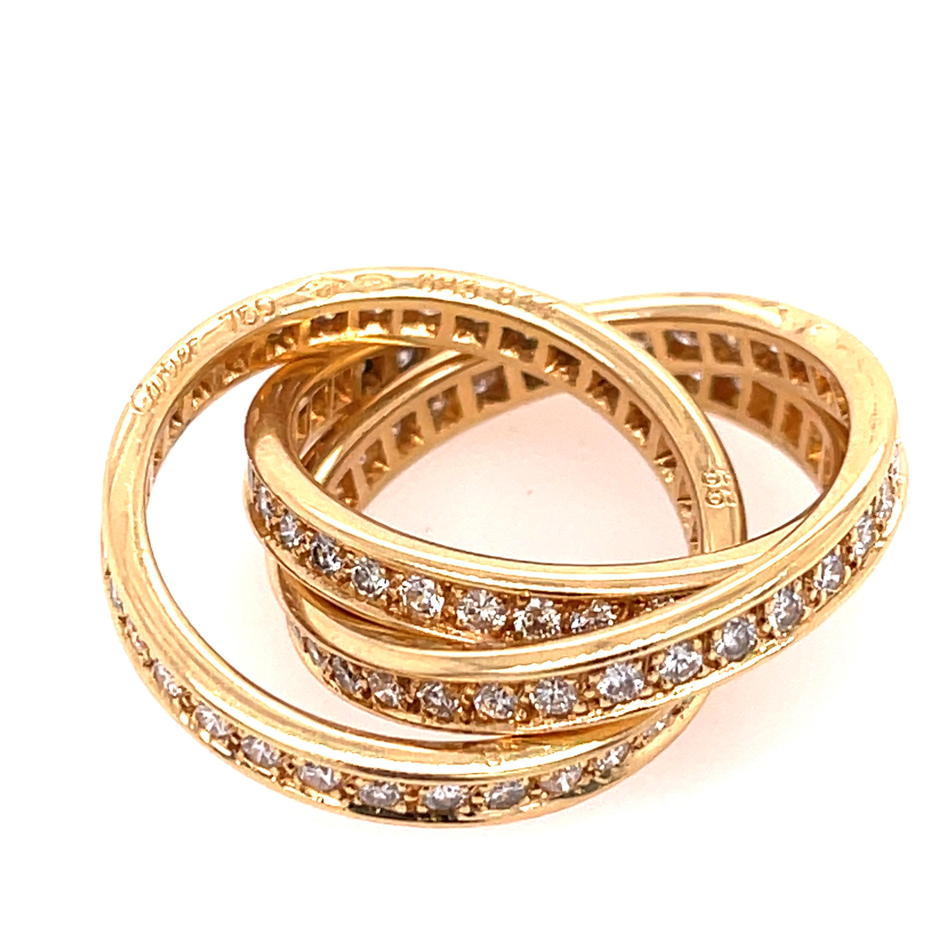 Cartier Trinity Ring in 18K Yellow Gold. The rings feature approximately 1.55ctw of brilliant cut round diamonds. Ring size 7.
