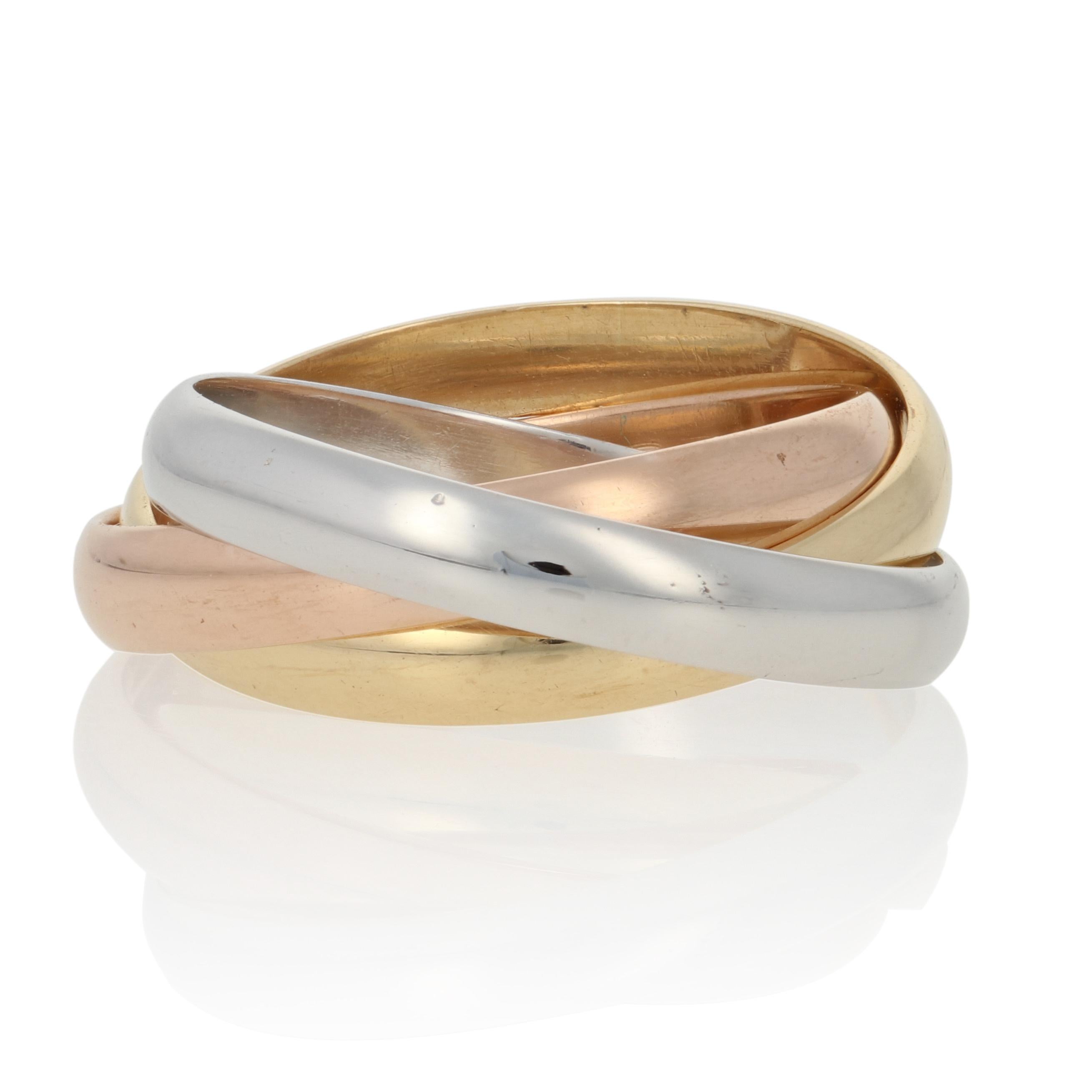 Brand: Cartier
Design: Trinity Ring

Size: 45 (US 3 1/2).

Style: Rolling Band
Metal Content: Guaranteed 18k Gold as stamped (yellow, white, and rose)
Face Height (north to south): 7/32