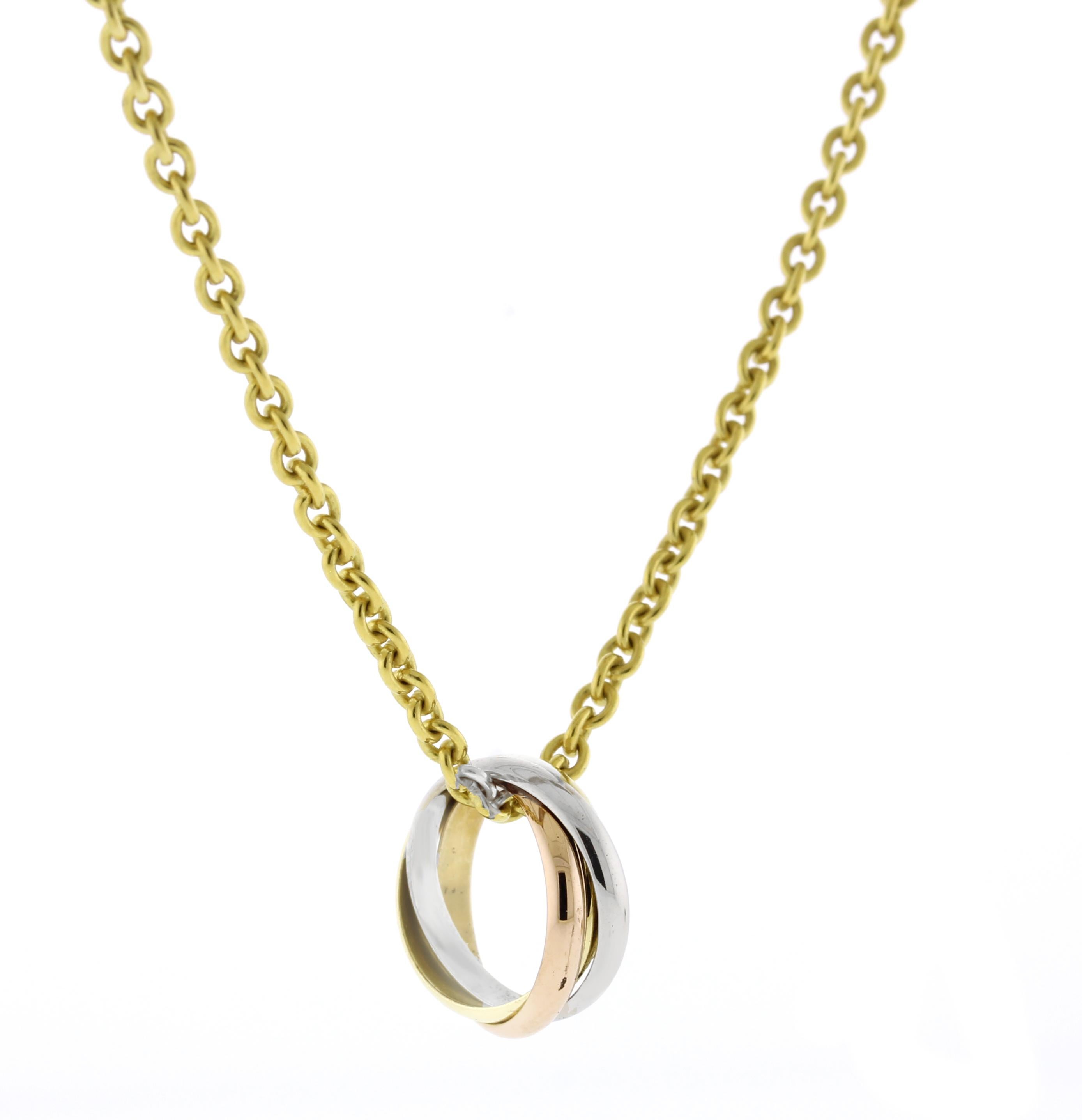 From Cartier's trinity collection, a trinity rolling ring pendant necklace.  Three bands. Three colors. Pink gold, yellow gold and white gold, intertwined in a display of mystery and harmony.  
♦ Designer: Cartier
♦ Metal: 18 karat
♦ Late 20th