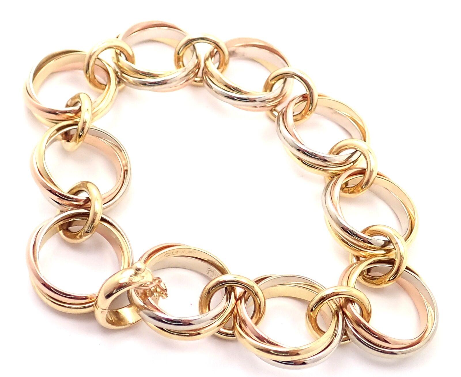 bracelet Trinity en or tricolore 18 carats (jaune, blanc, rose) à larges maillons ronds par Cartier. 
Détails : 
Longueur : 7 3/4