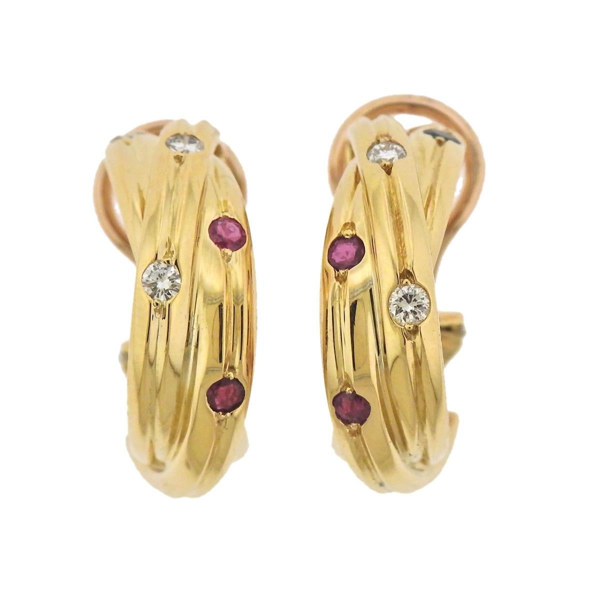  18k yellow gold Trinity hoop earrings, crafted by Cartier, decorated with sapphires, rubies and approx. 0.12ctw in G/VS diamonds. Earrings are 21mm x 6.5mm, weigh 13 grams. Marked: Cartier, 750 B22 944.