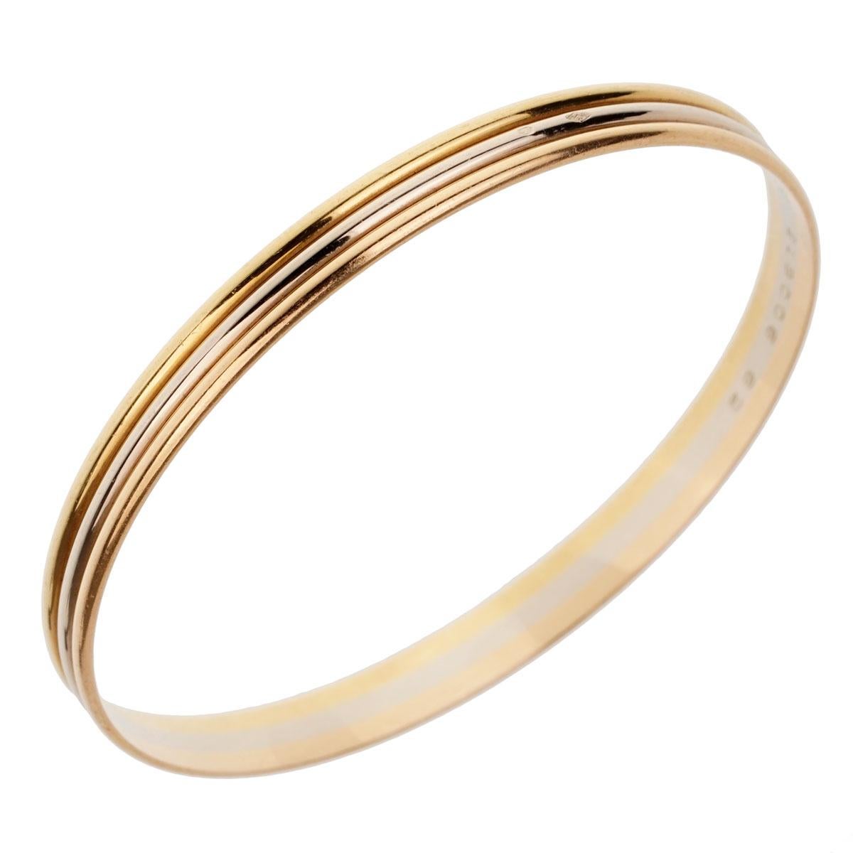 An iconic Cartier trinity slip on bangle in 18k yellow, rose and white gold.
