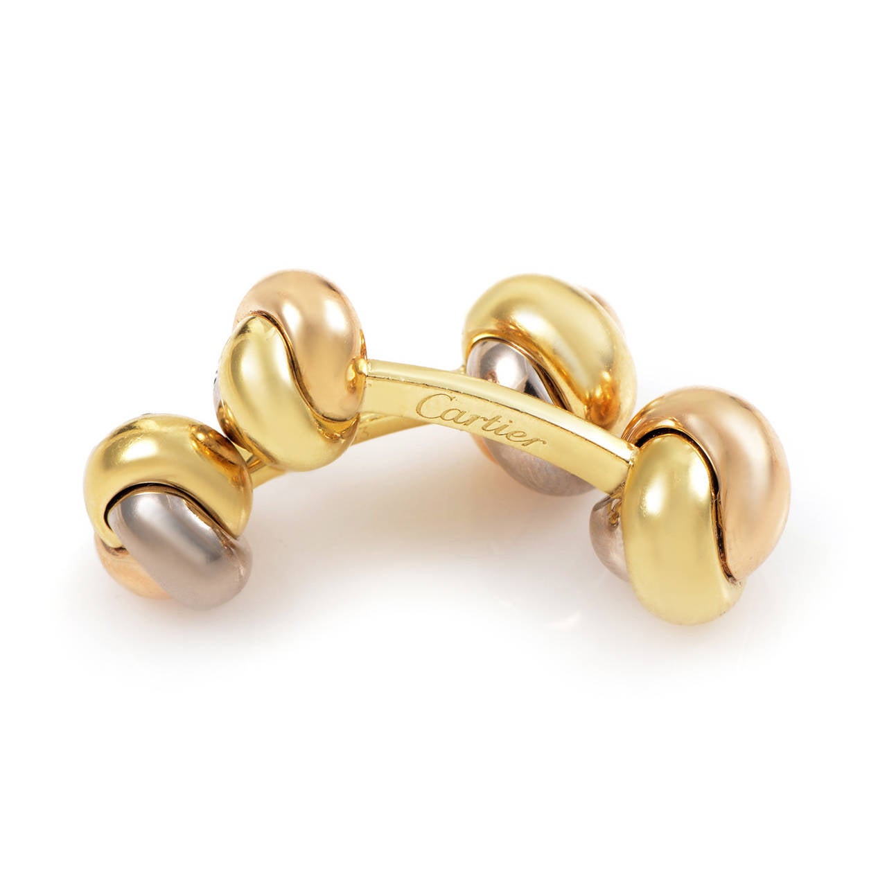 This dazzling pair of cufflinks from Cartier's Trinity collection are perfect for a man or a woman. The cufflinks are made of a combination of 18K white, yellow and rose gold.