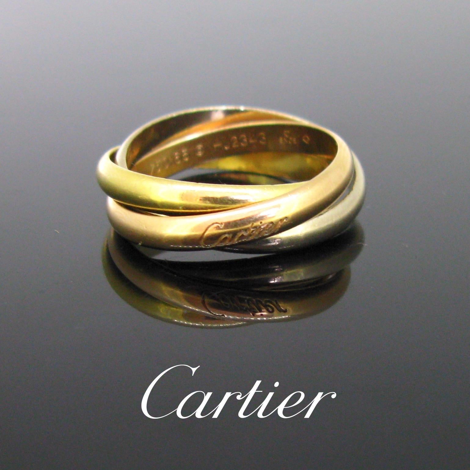 This timeless ring comprises of 3 bands: one rose, one yellow and one white, all is 18kt gold. The rose one is signed and numbered. Louis Cartier created the Trinity collection in 1924 for his friend the famous French poet Jean Cocteau. The rose