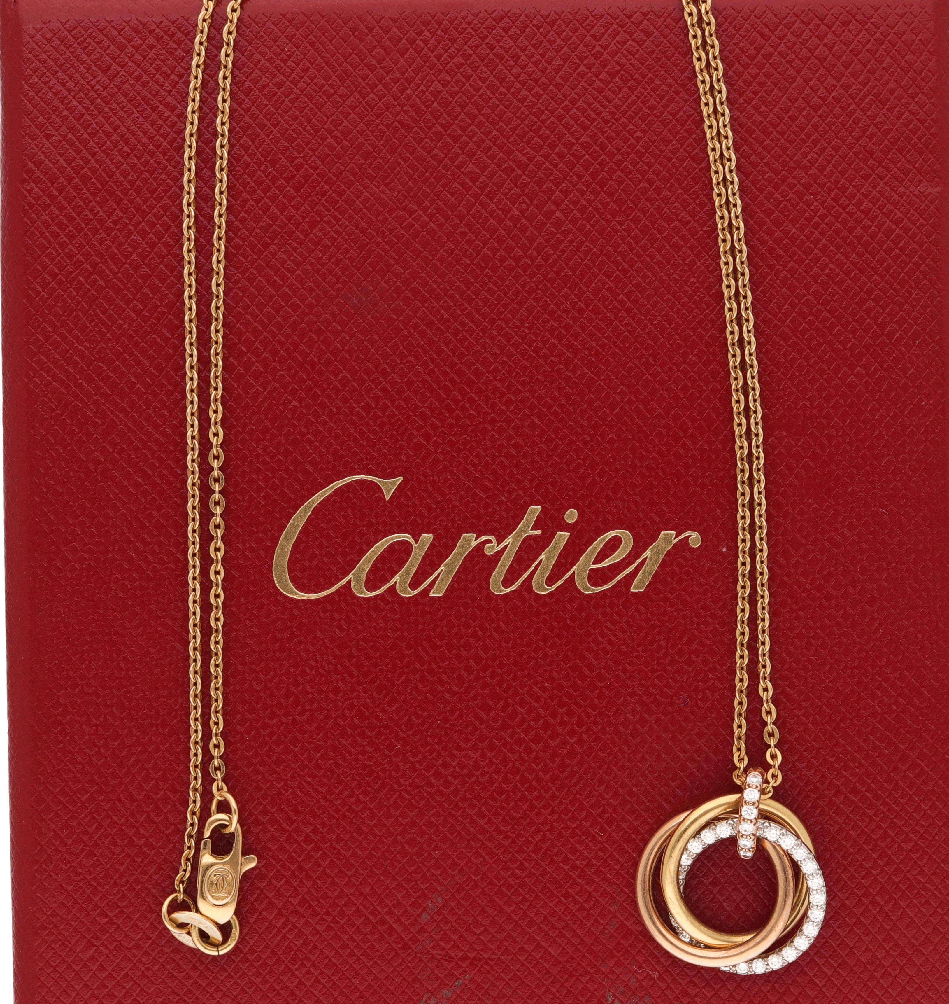 Three tone 18 karat gold necklace signed by Cartier.
This iconic design is realized in 18 karat yellow, white and rose gold with 0.20 carat of round-cut diamonds.
The Trinity collection was born in 1924.
The three gold's colors represent three
