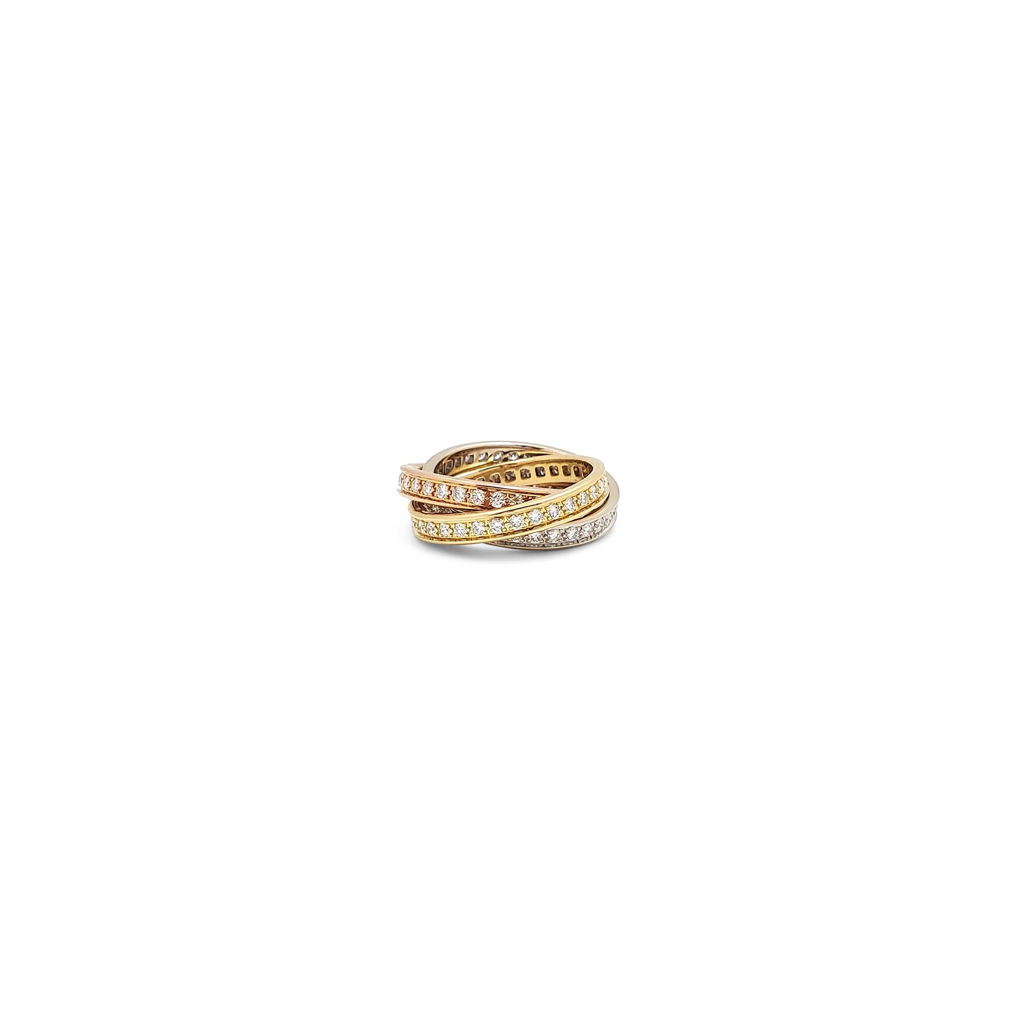 Authentic Cartier 'Trinity' ring comprised of three interlocking mobile bands of 18 karat yellow, rose, and white gold. Each ring is set with a single row of high-quality round brilliant cut diamonds for an estimated 1.55 carats total weight. 