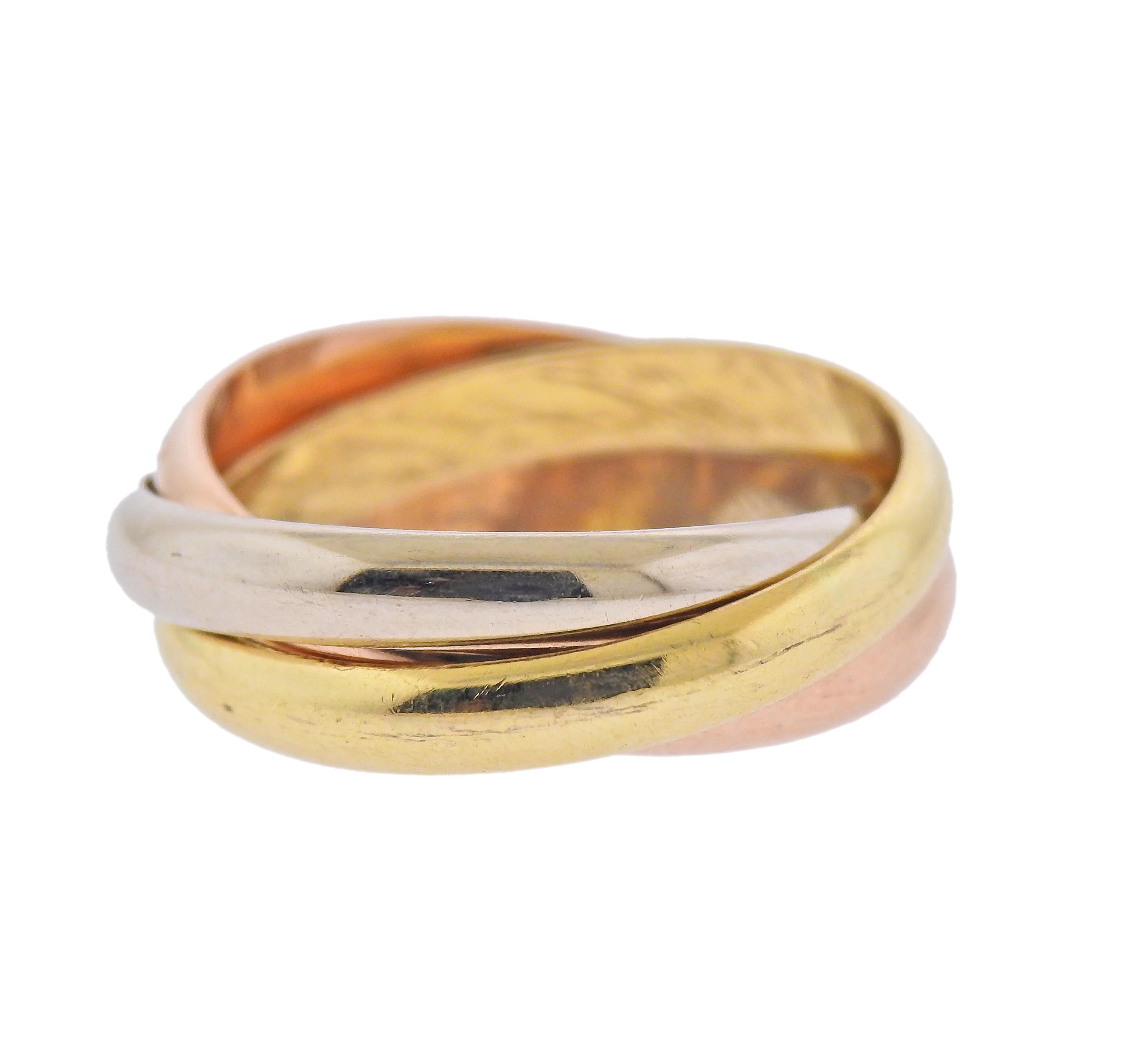 Signature Cartier Trinity 18k rose, white and yellow gold ring. Size 9.25, (Cartier French size 61). Marked: le must deCartier, 61, 750. Weight - 10.4 grams.