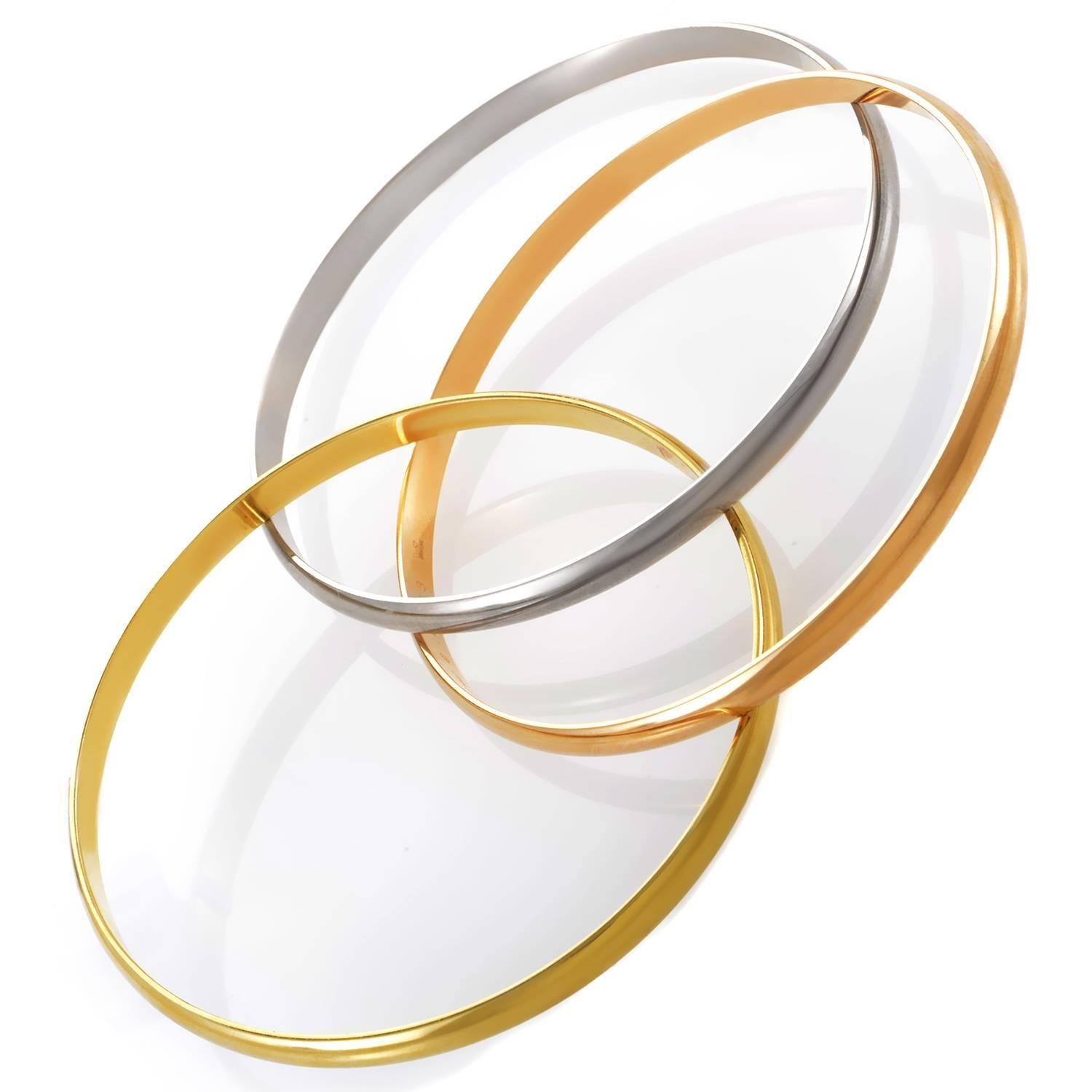 Entwining in graceful fashion to create a gleaming festival of bright shimmers, warm radiance and charming exuberance, the three components of this outstanding bracelet from Cartier are made of 18K white, rose and yellow gold for a fascinating sight.